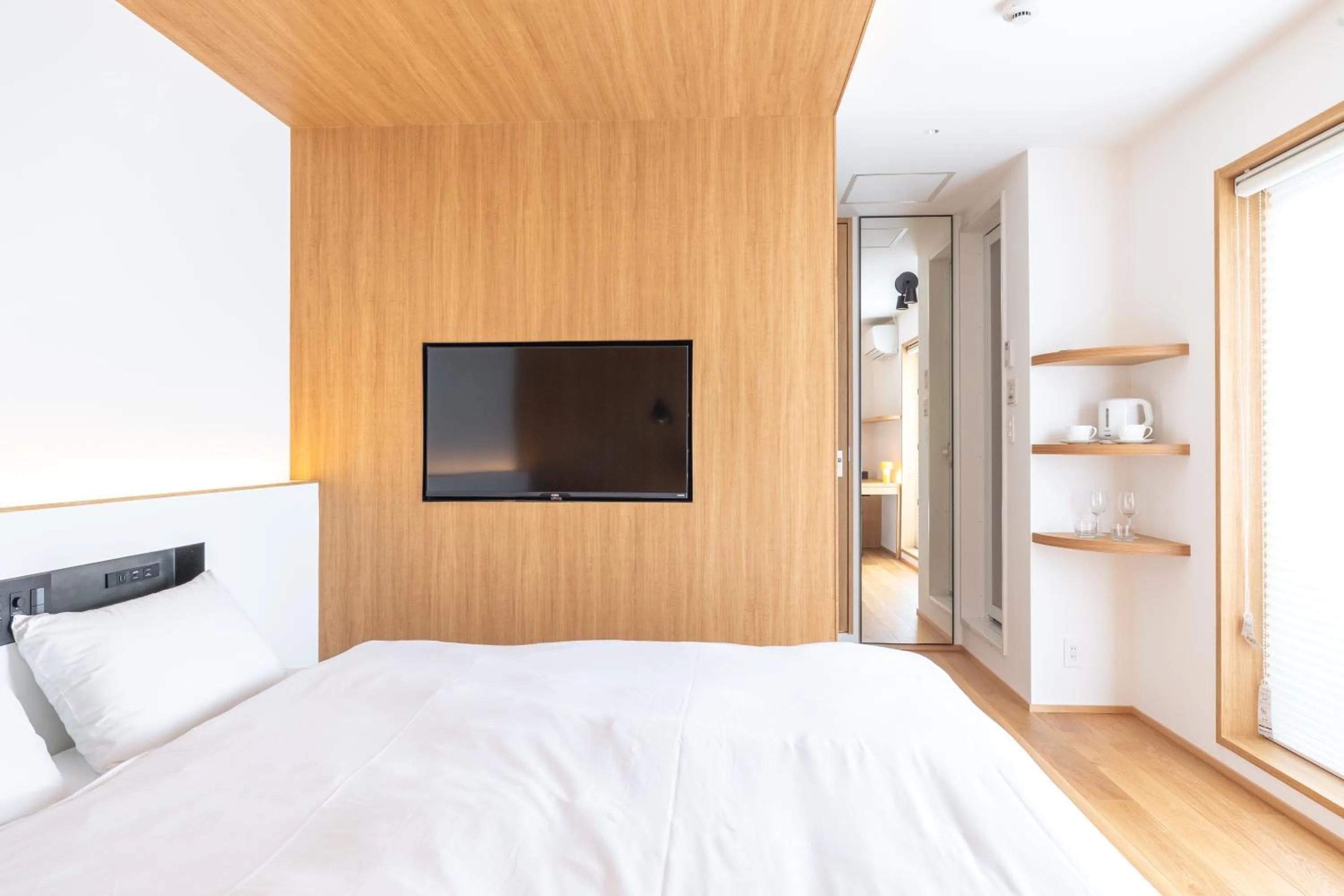 Bed in Karasuma Rokujo Hotel