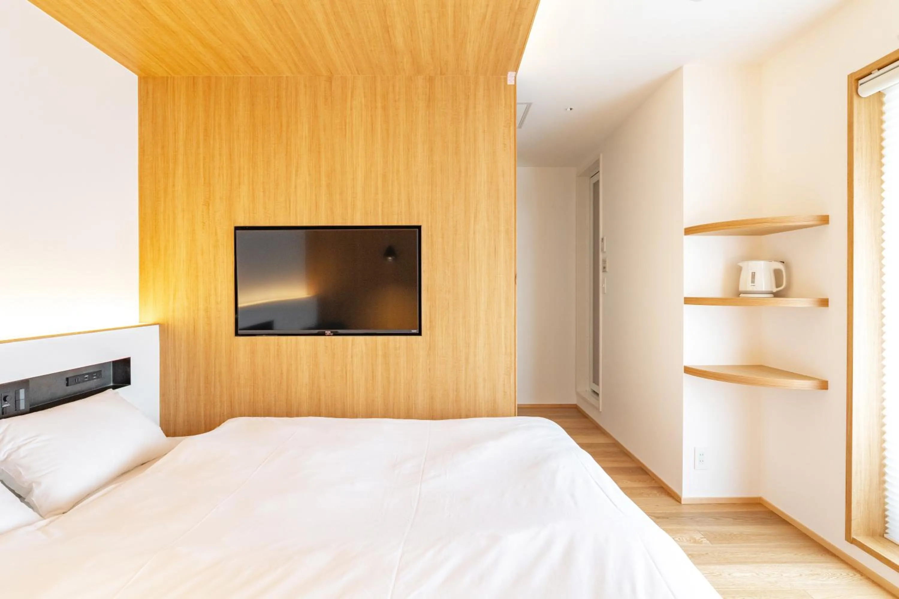 Bed in Karasuma Rokujo Hotel