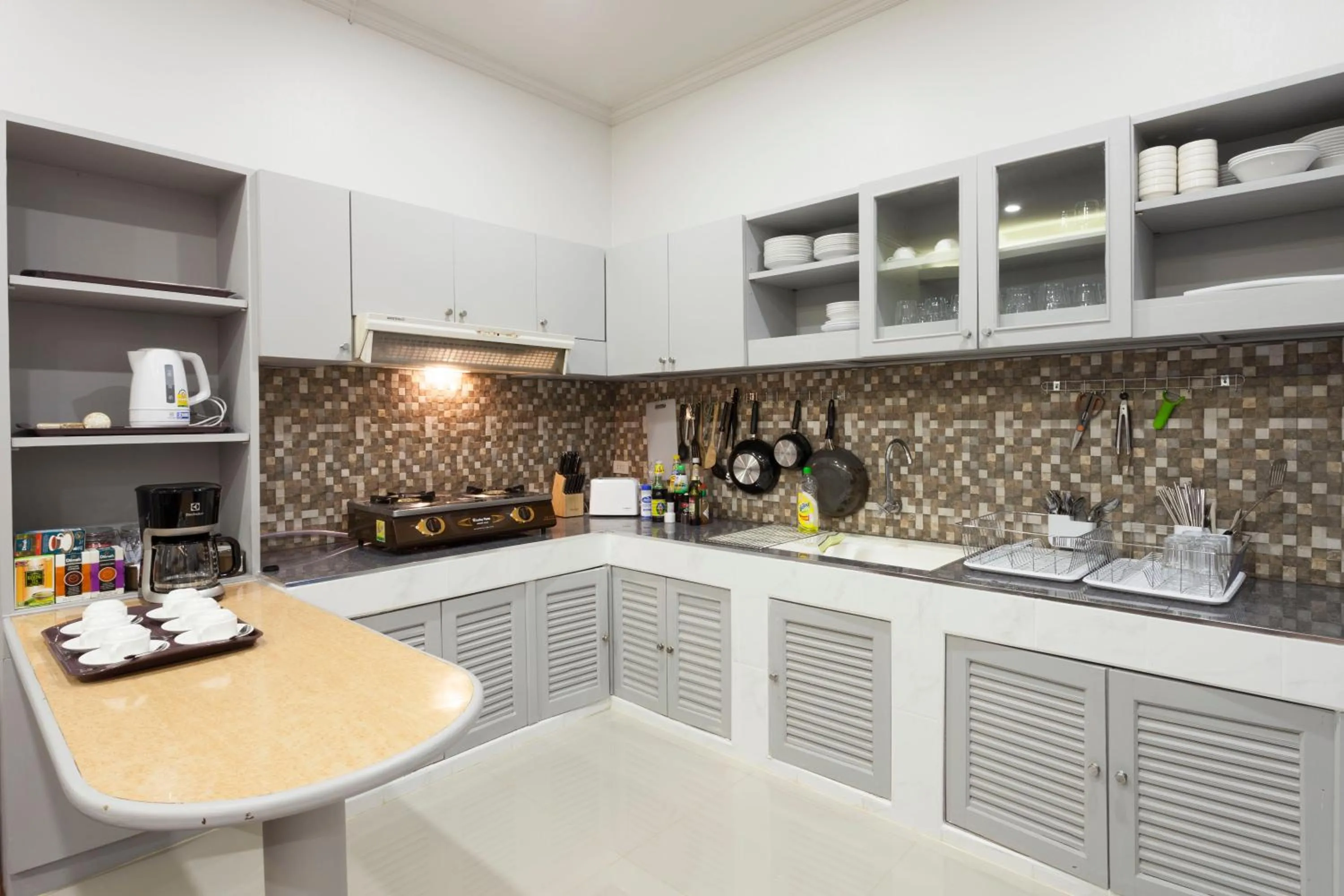 Communal kitchen in Cozy Home by Nan