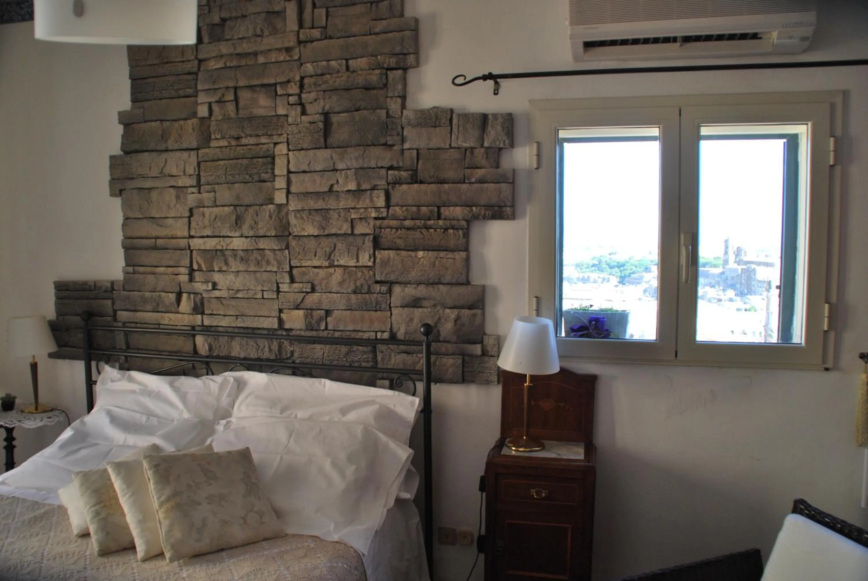 Decorative detail, Bed in Casa tipica siciliana patronale home BedandBreakfast TreMetriSoprailCielo Camere con vista, colazione interna in terrazzo panoramico