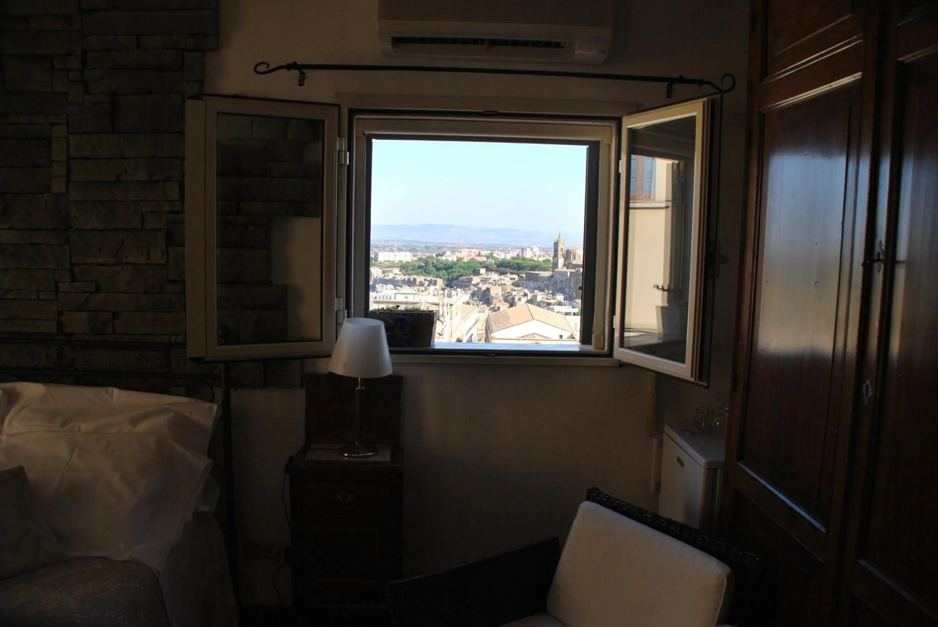 Bedroom in Casa tipica siciliana patronale home BedandBreakfast TreMetriSoprailCielo Camere con vista, colazione interna in terrazzo panoramico