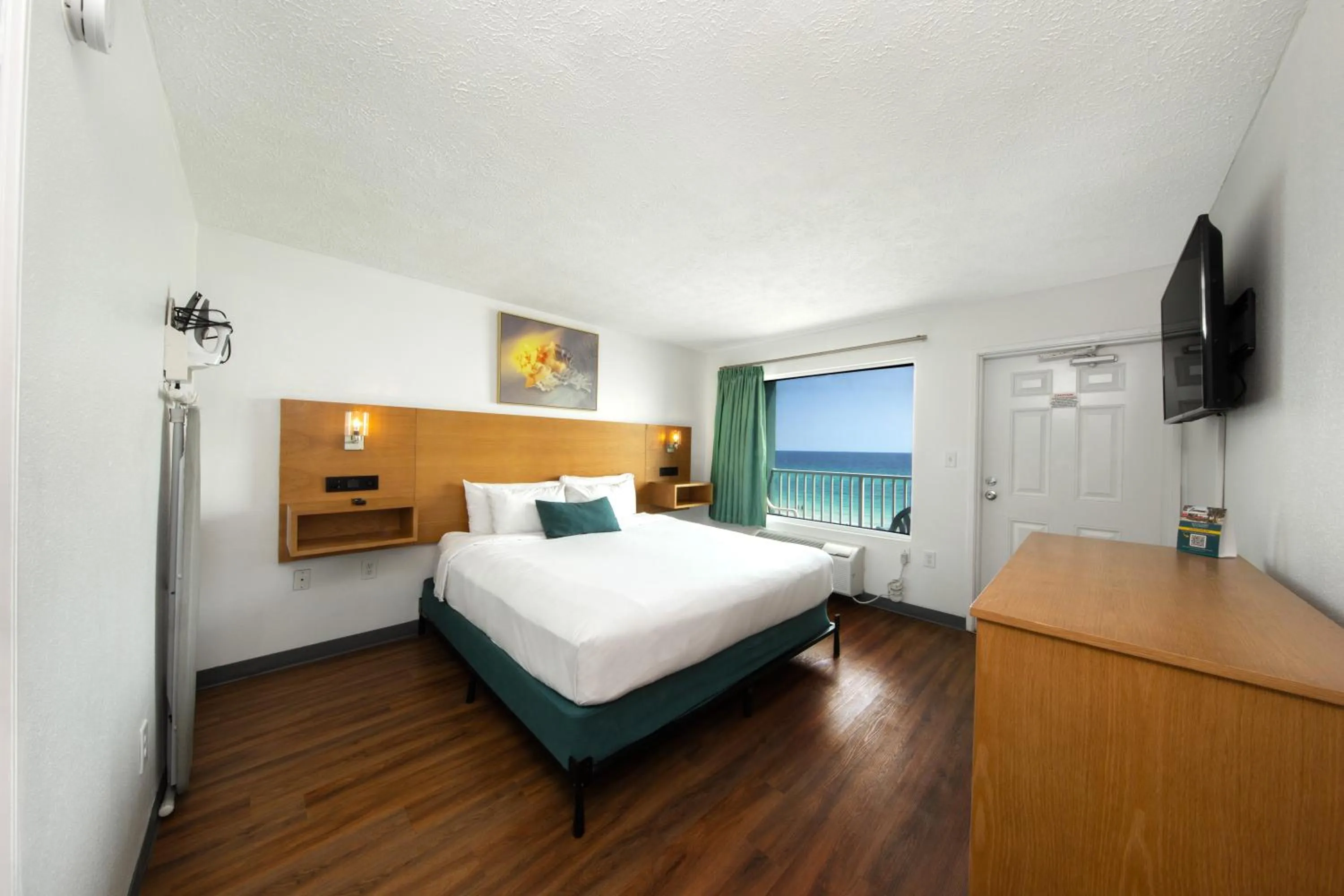 Bed in Beachcomber Beachfront Hotel, a By The Sea Resort