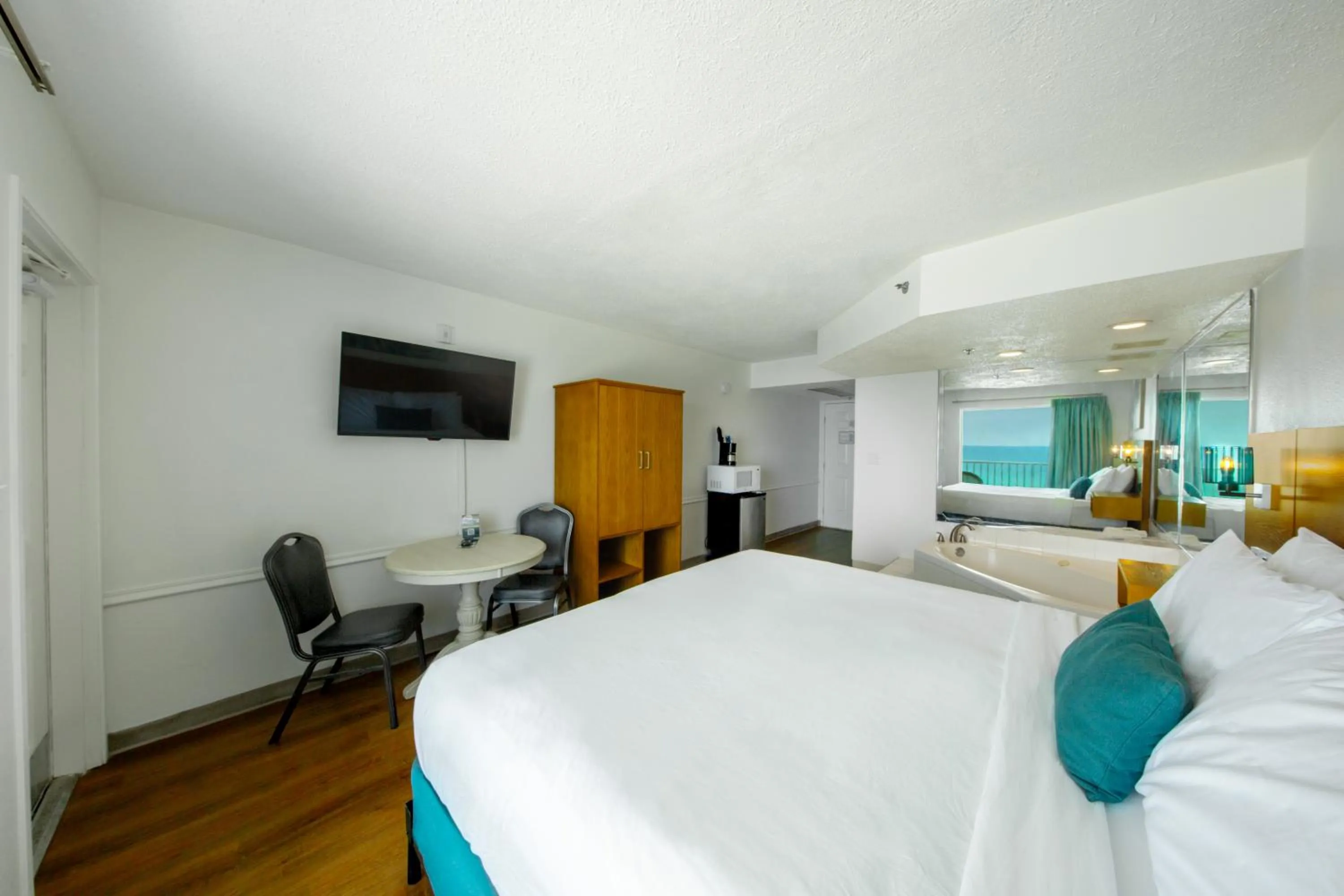 Bed in Beachcomber Beachfront Hotel, a By The Sea Resort