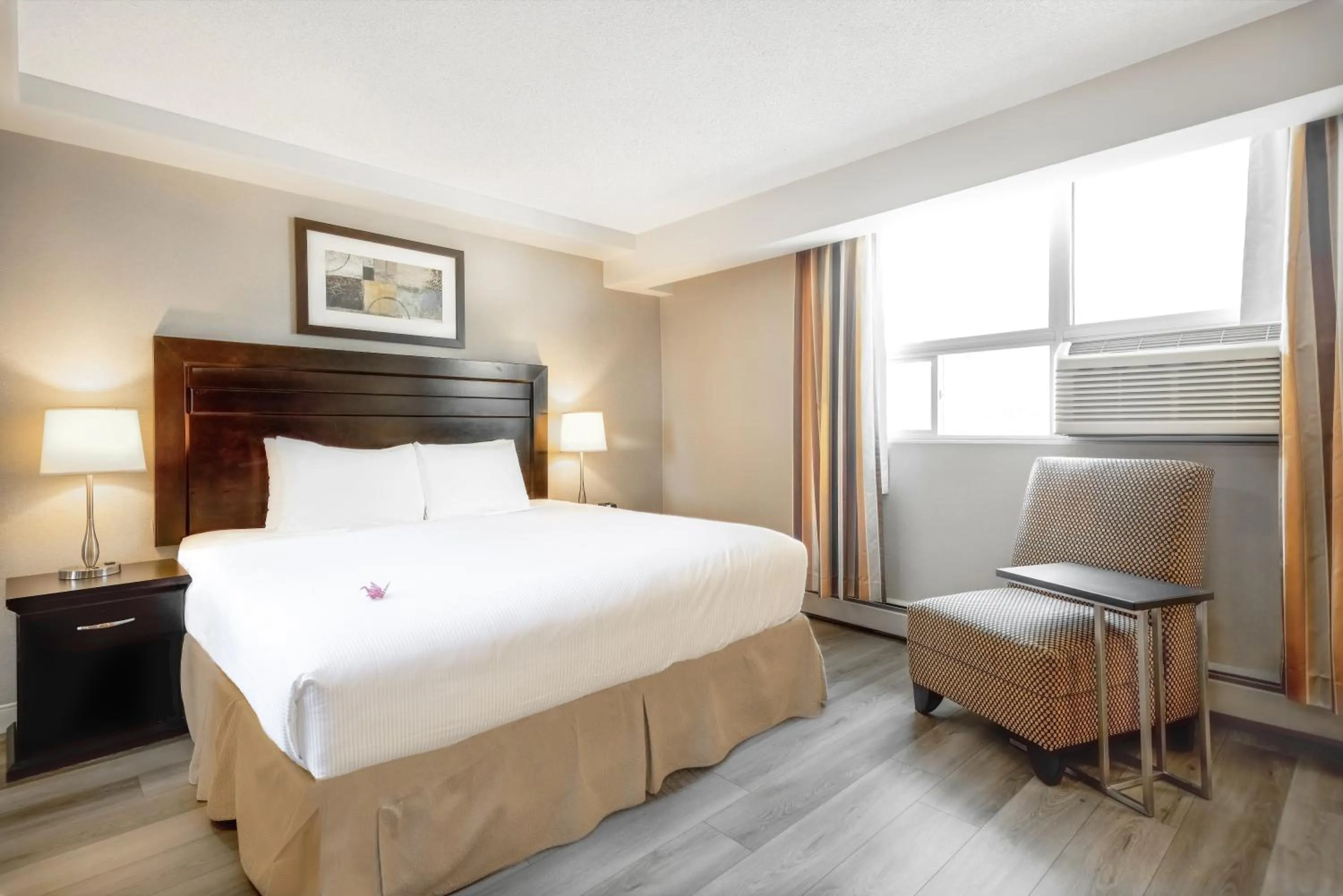 Bed in Coast Calgary Downtown Hotel & Suites by APA