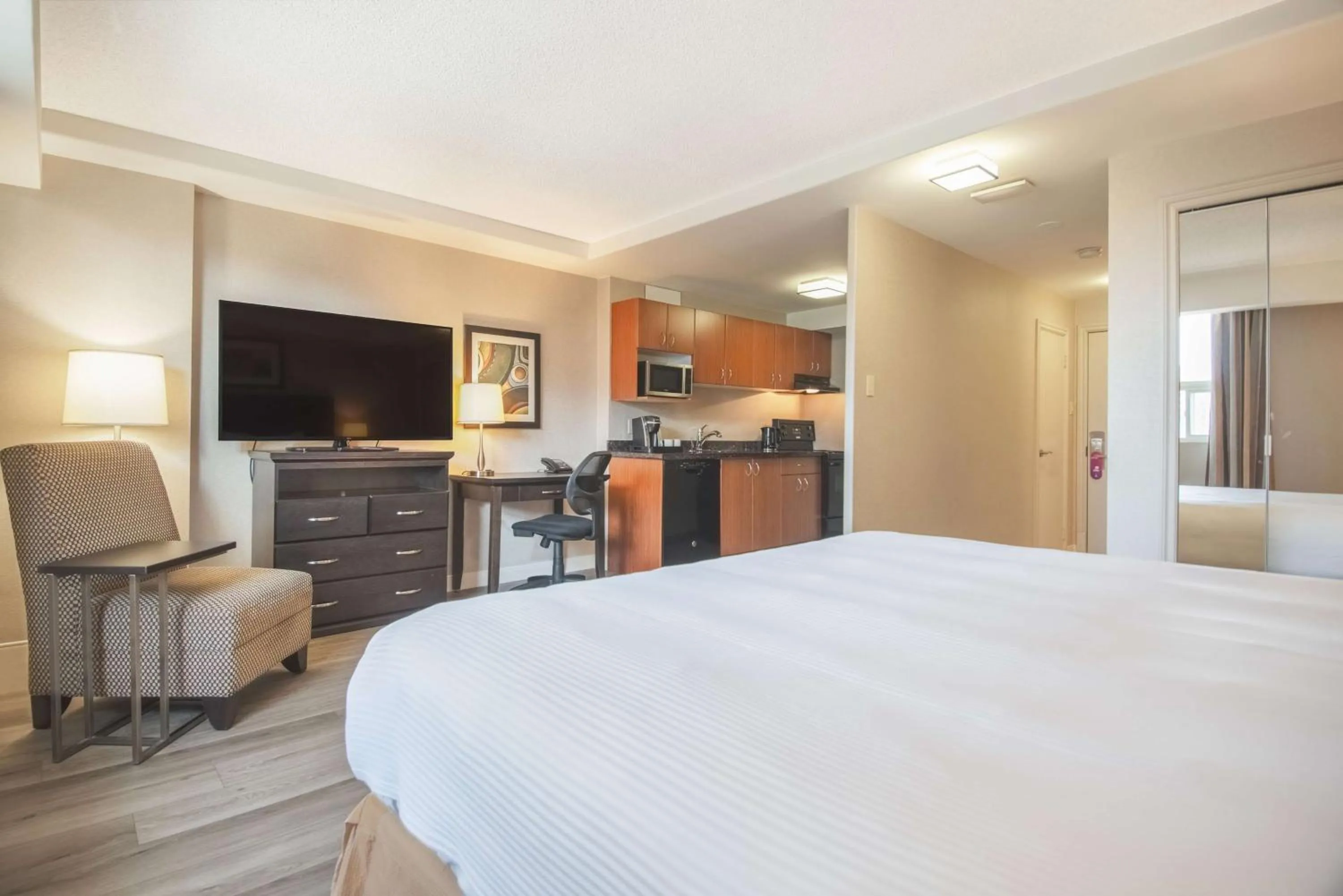 Photo of the whole room, Bed in Coast Calgary Downtown Hotel & Suites by APA