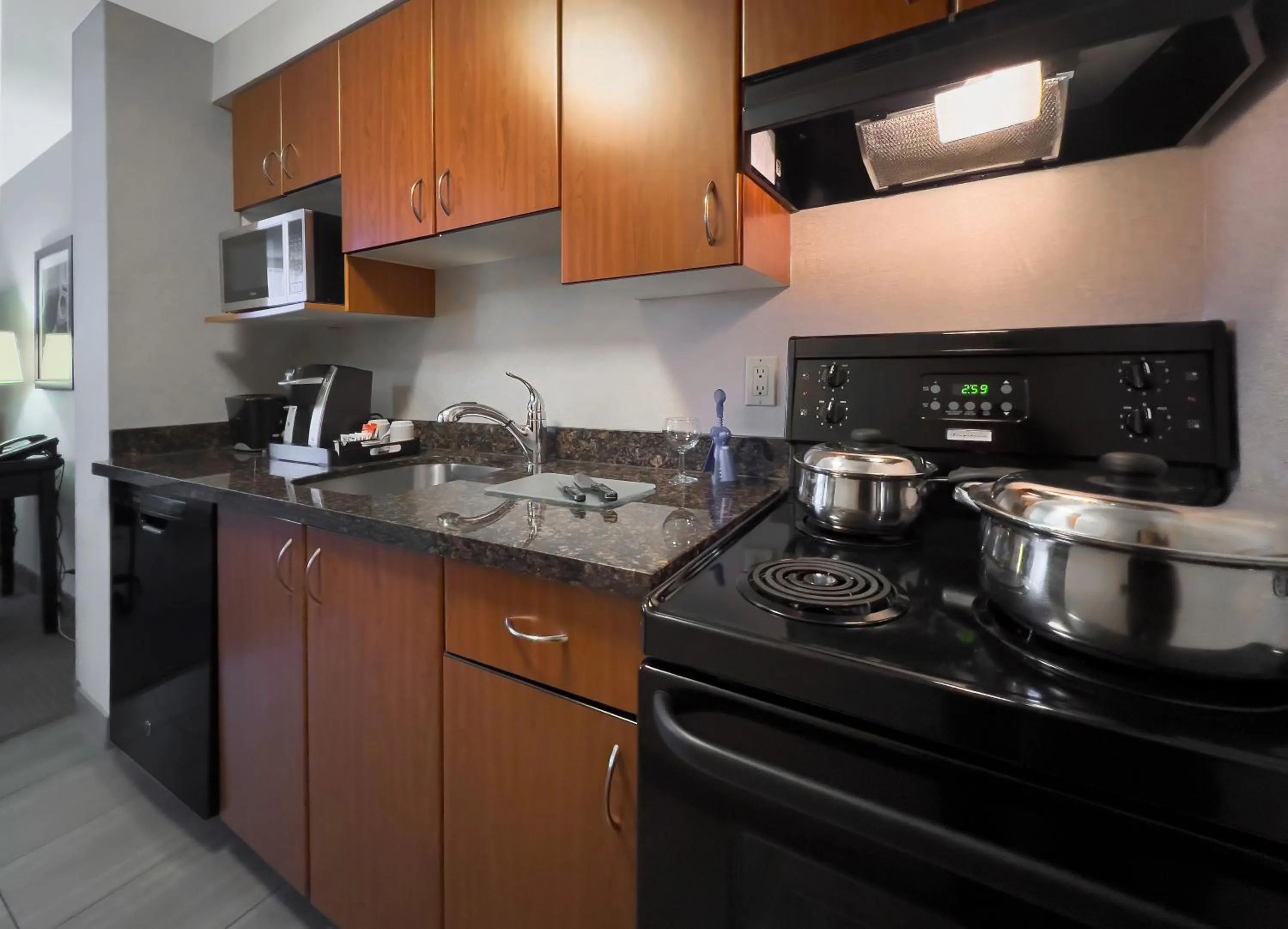 Kitchen or kitchenette in Coast Calgary Downtown Hotel & Suites by APA