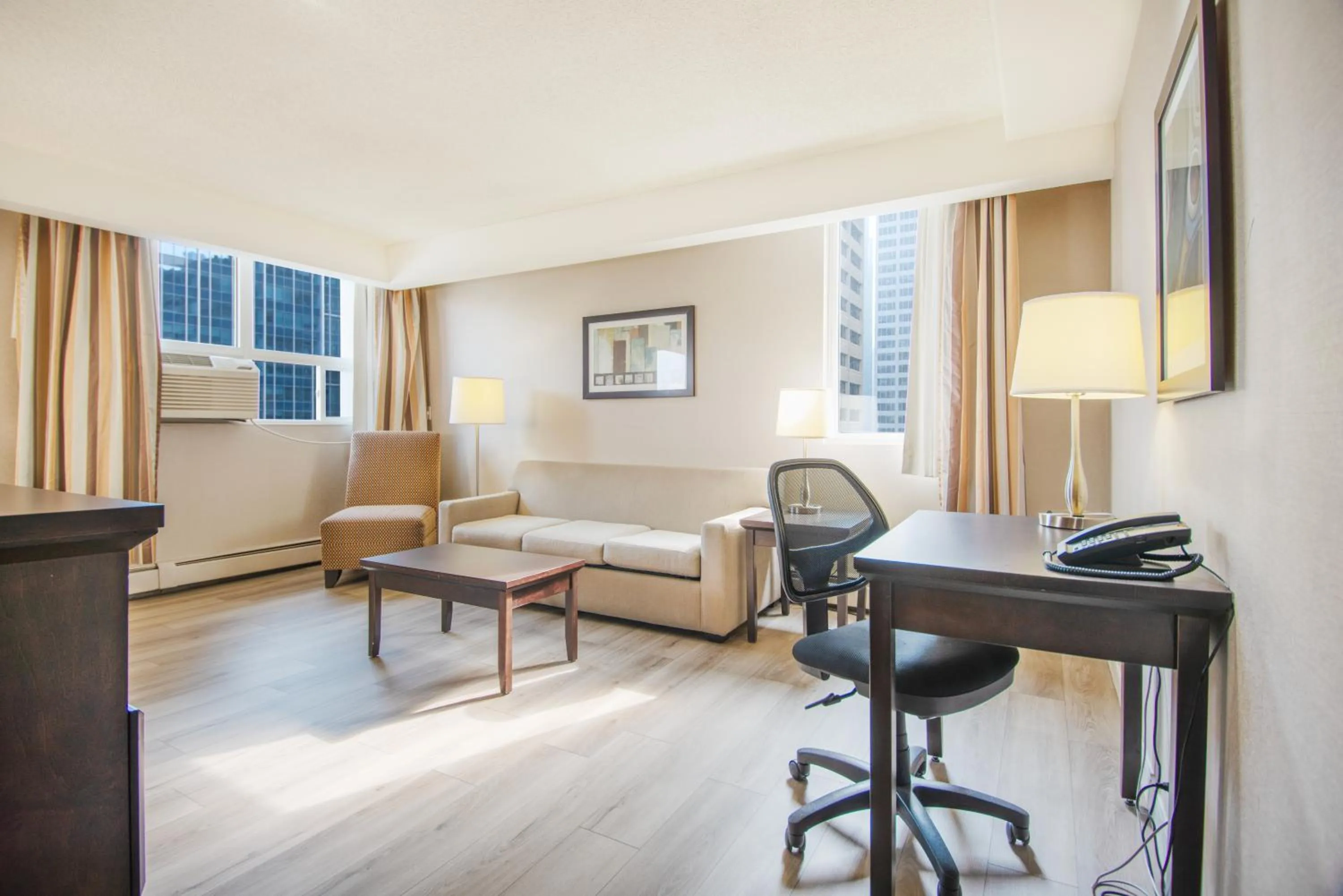 Living room in Coast Calgary Downtown Hotel & Suites by APA