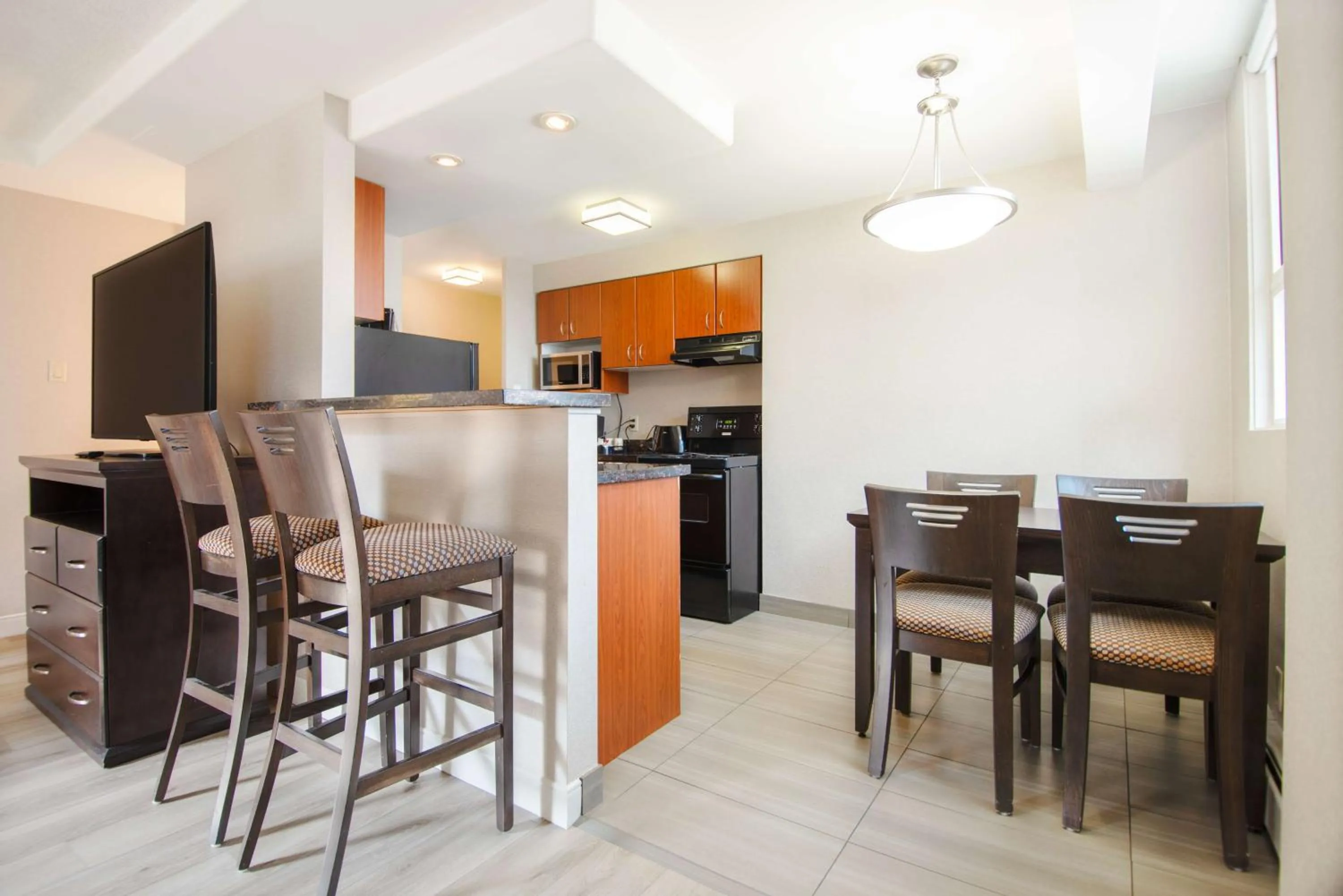 Kitchen or kitchenette in Coast Calgary Downtown Hotel & Suites by APA
