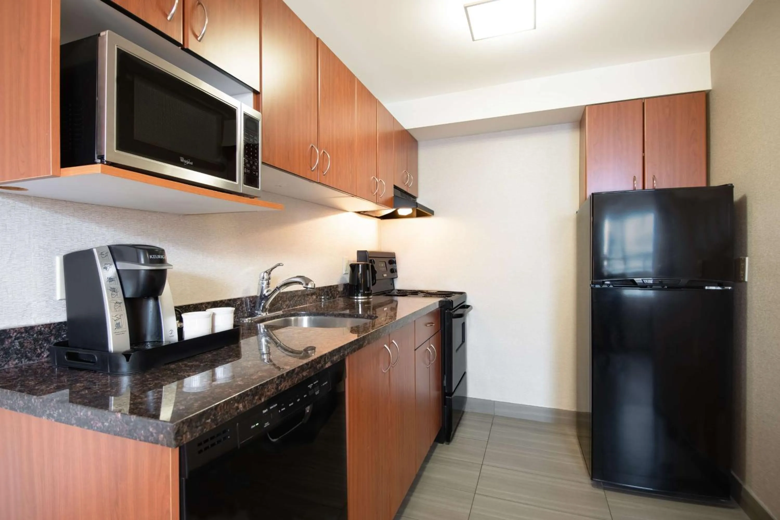 Kitchen or kitchenette in Coast Calgary Downtown Hotel & Suites by APA
