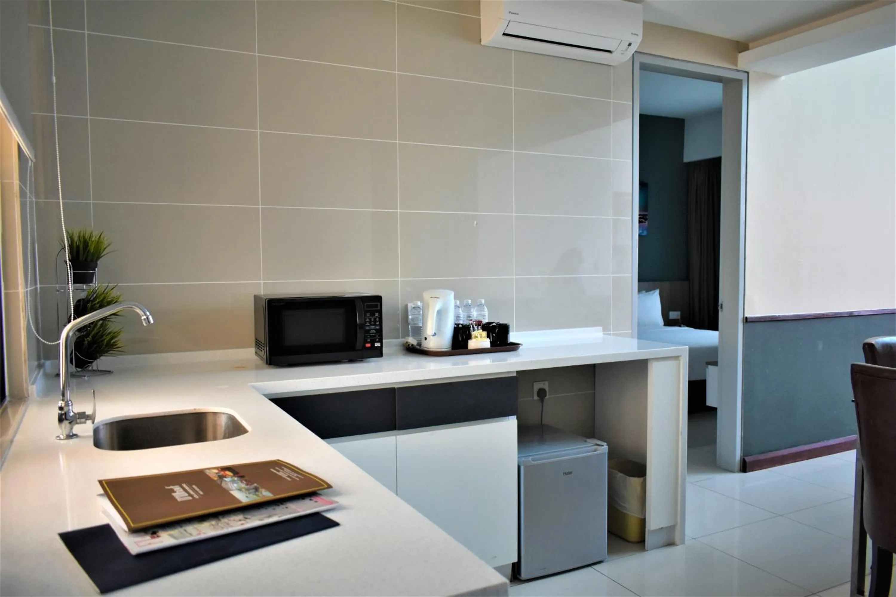 Kitchen or kitchenette in D'Wharf Hotel & Serviced Residence