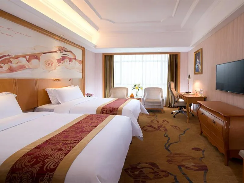 Bed in Vienna International Hotel Huazhou East Beijing Road