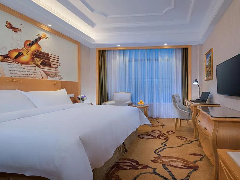 Bed in Vienna Hotel Guangdong Heyuan Lianping