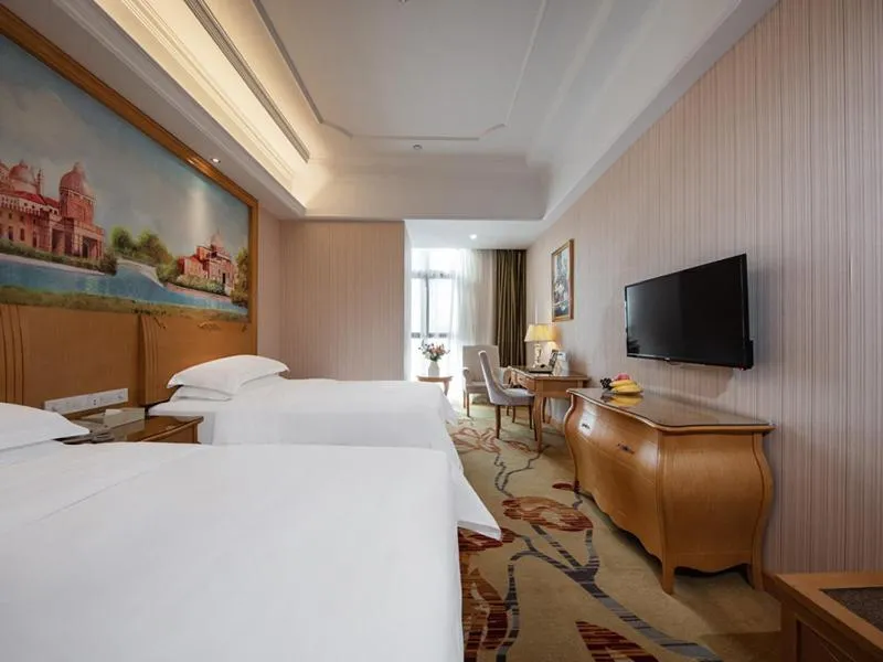 Bed in Vienna International Hotel Fuzhou Cangshan Wanda