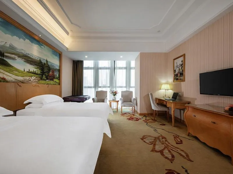 Bed in Vienna International Hotel Fuzhou Cangshan Wanda