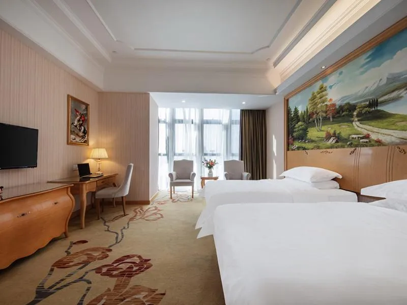 Bed in Vienna International Hotel Fuzhou Cangshan Wanda