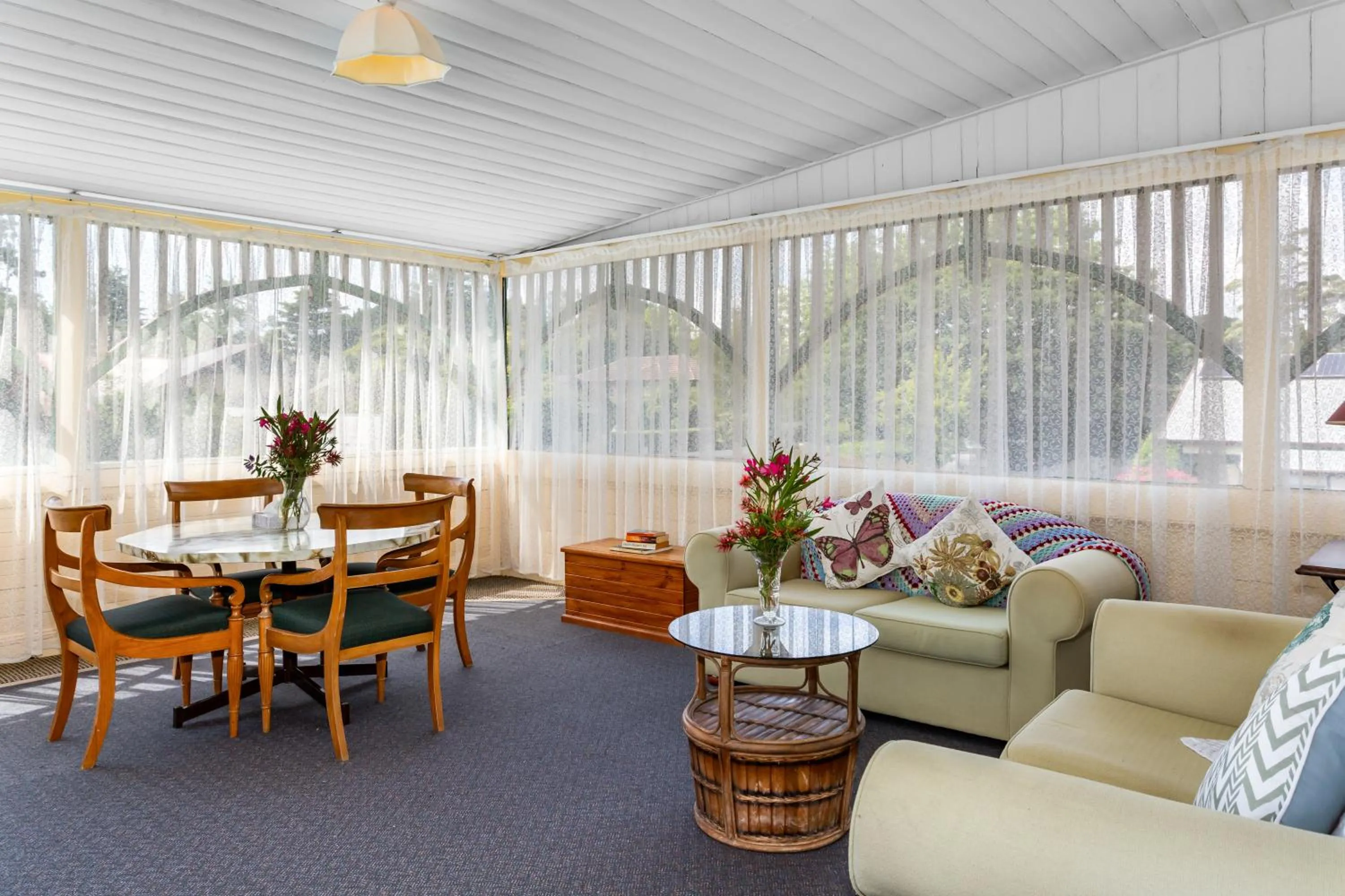 Communal lounge/ TV room in La Maison Boutique Hotel