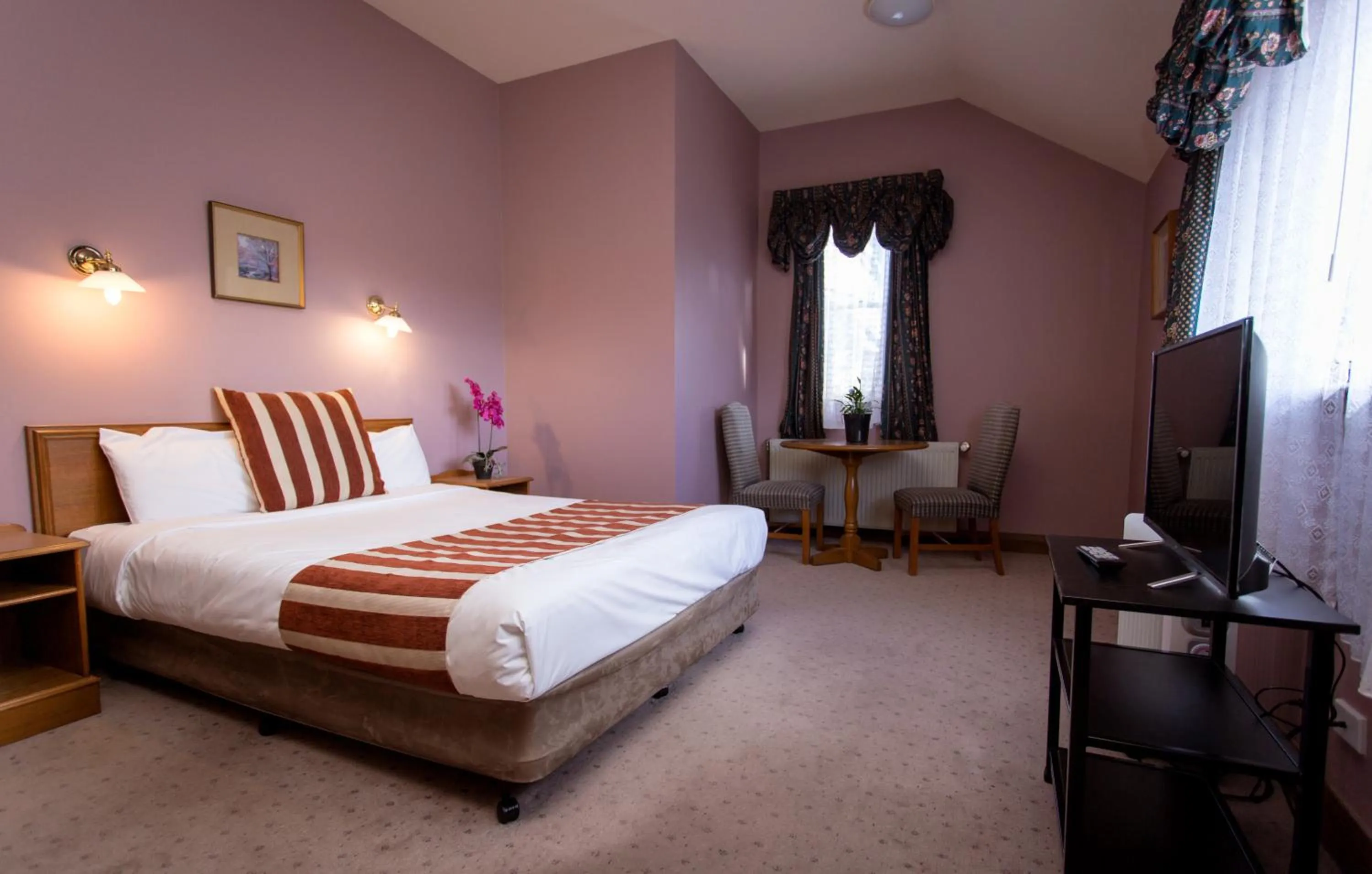 Bed in La Maison Boutique Hotel