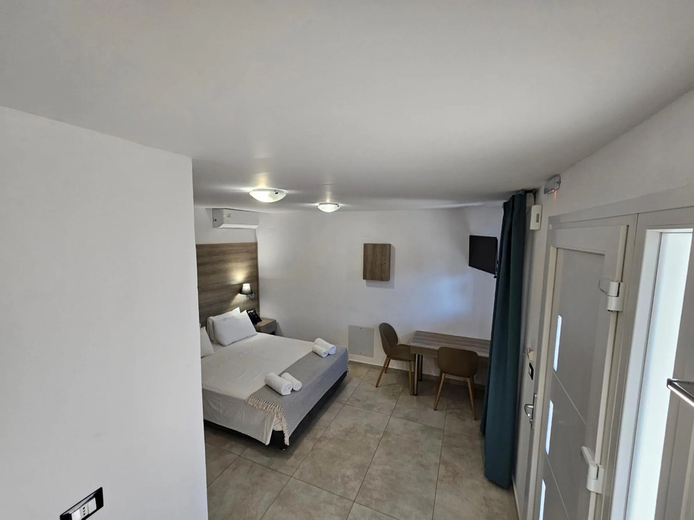 Bed in Elounda Sunrise Apartments