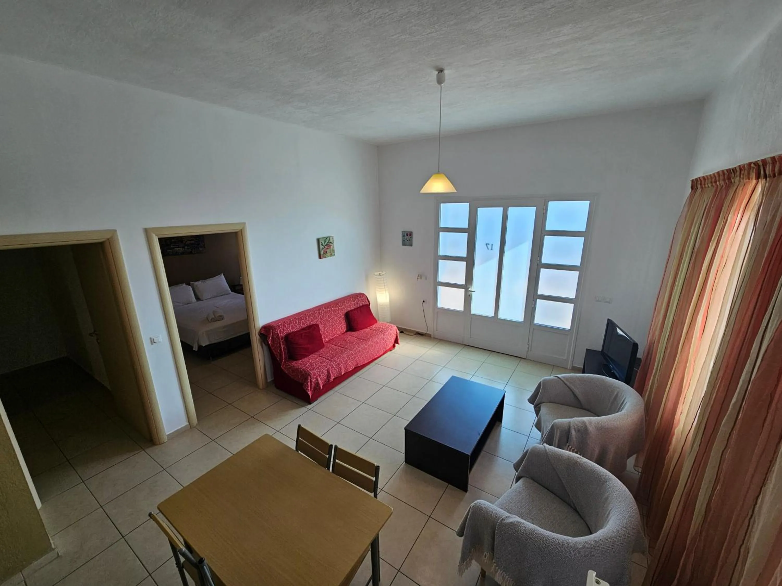 Seating area, Bed in Elounda Sunrise Apartments