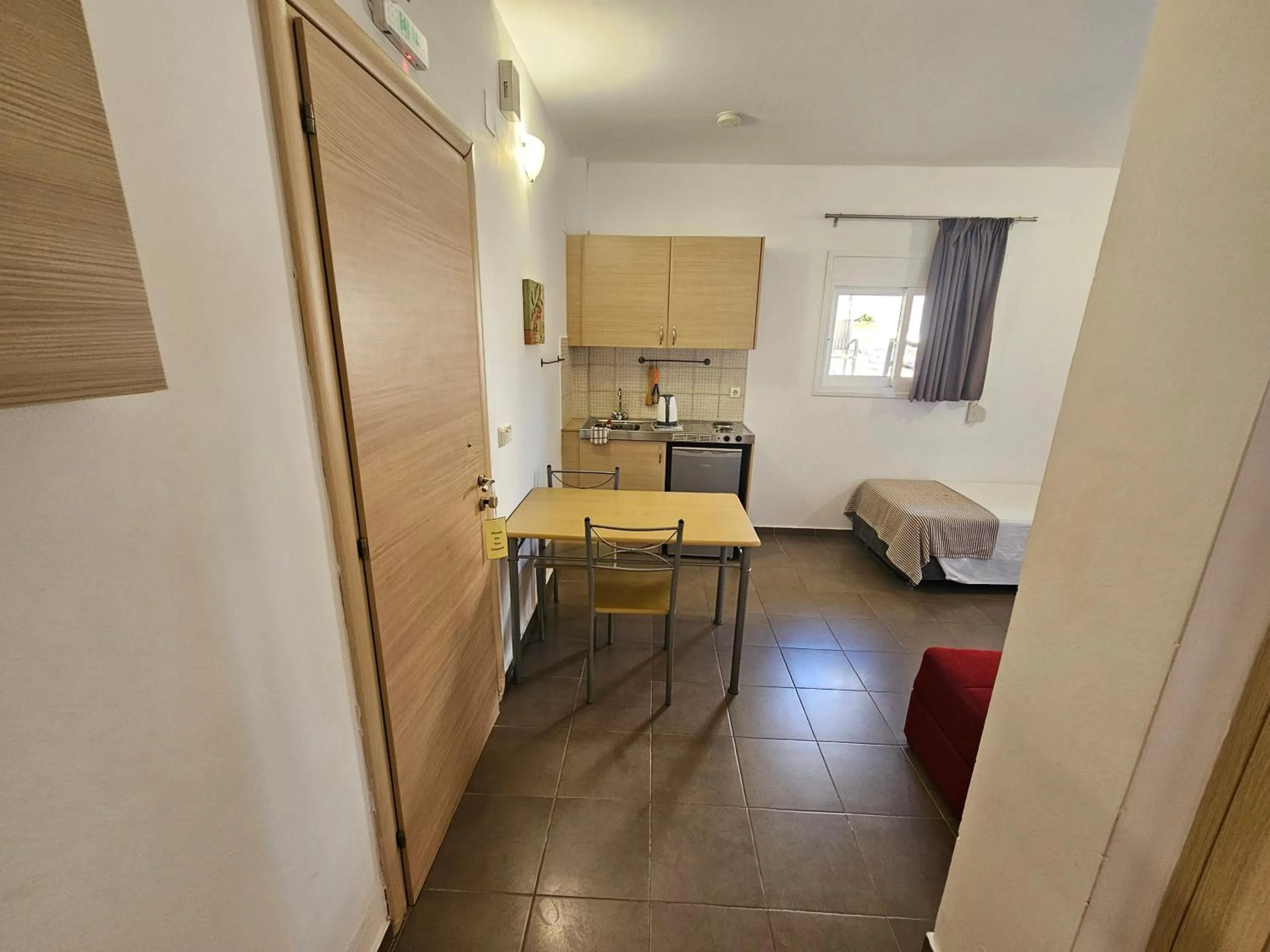 Kitchen or kitchenette, Bed in Elounda Sunrise Apartments