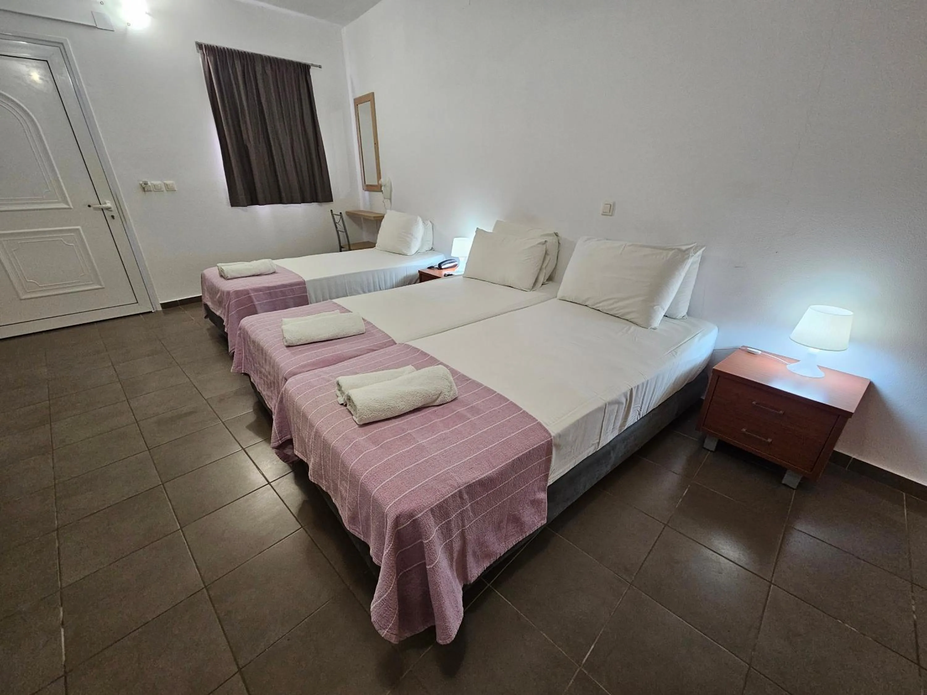 Bed in Elounda Sunrise Apartments