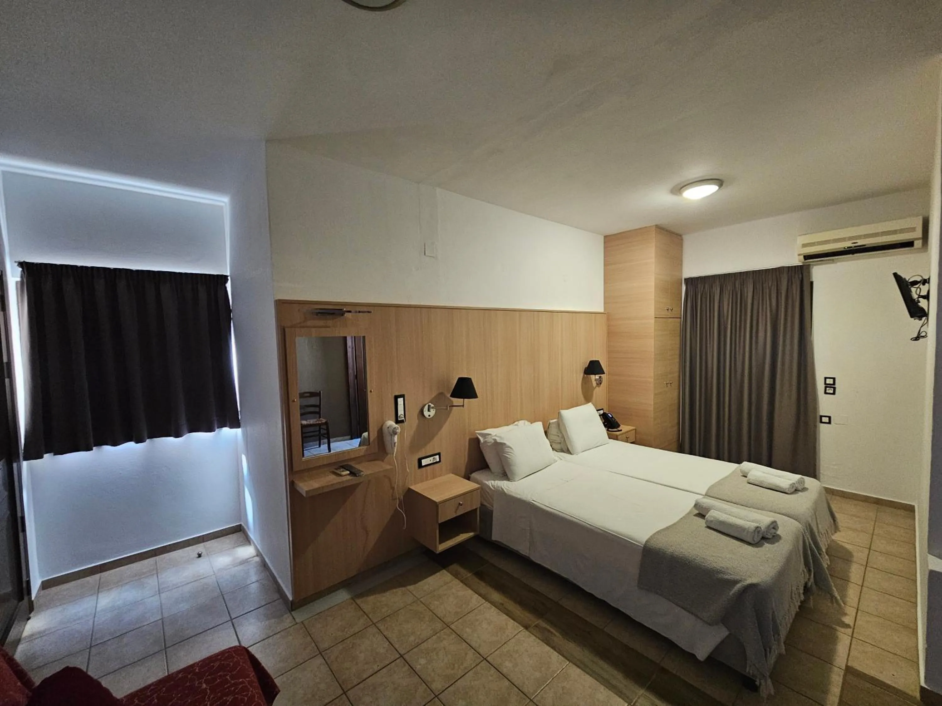 Bed in Elounda Sunrise Apartments