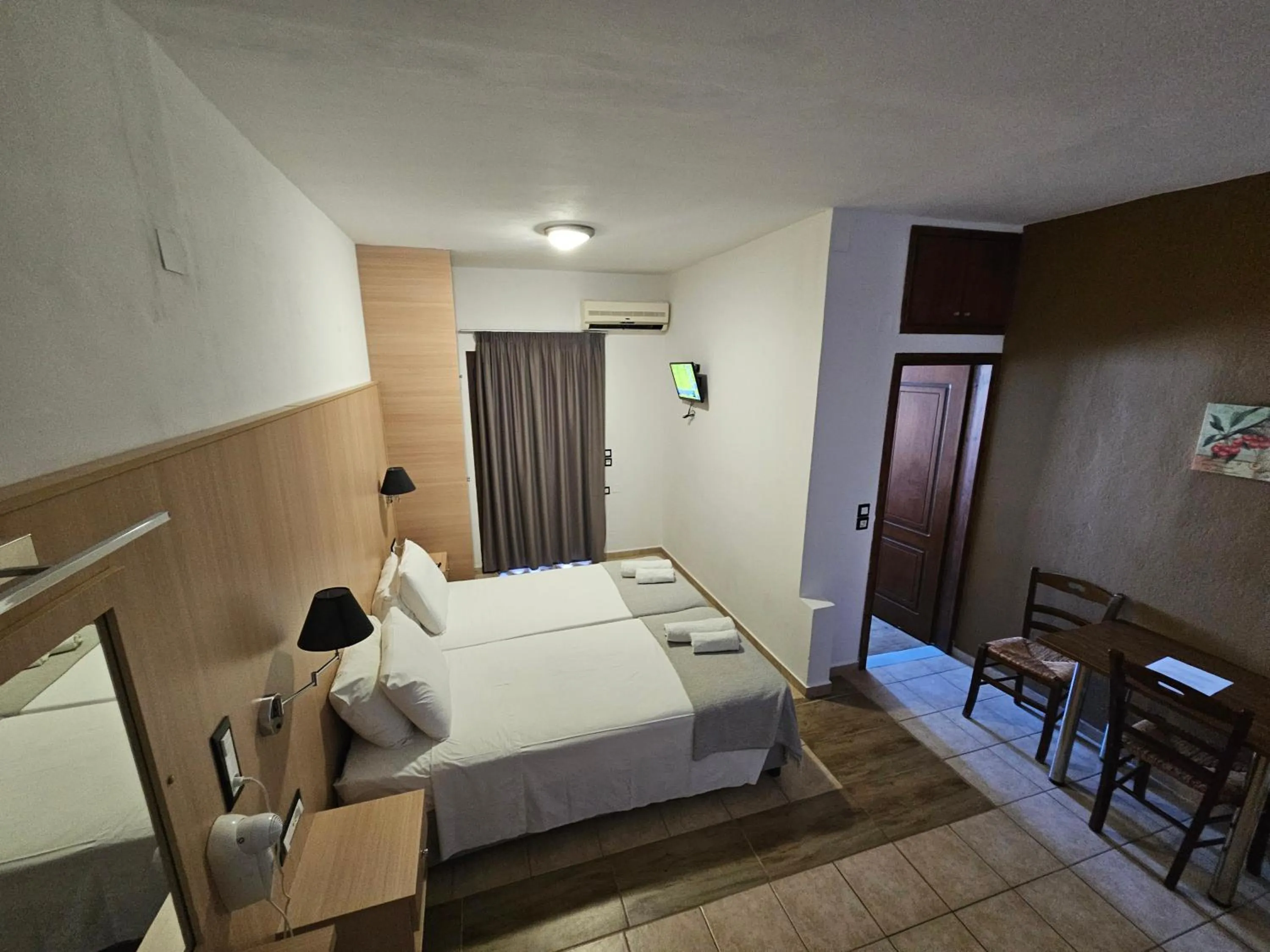 Bed in Elounda Sunrise Apartments