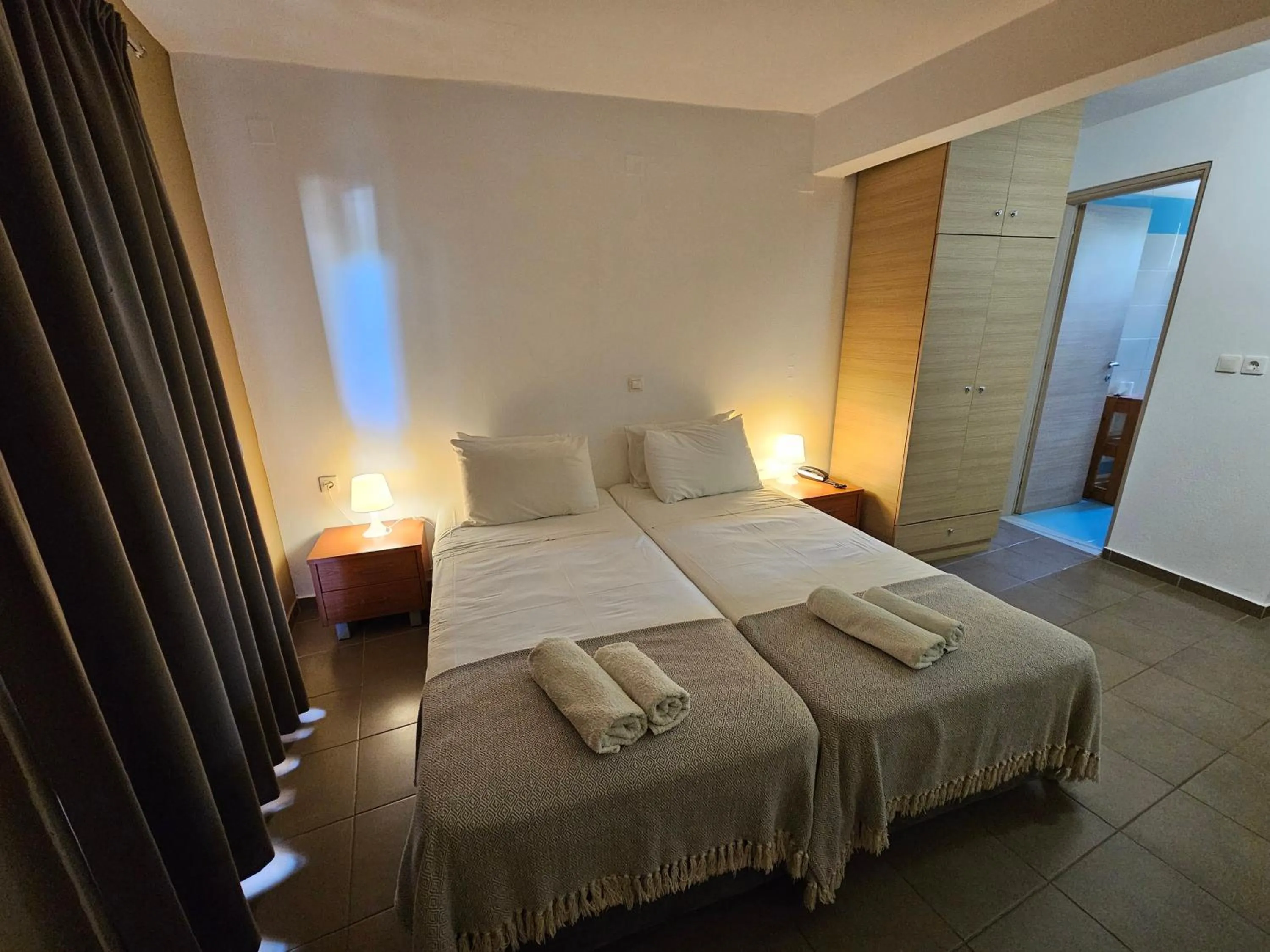 Bed in Elounda Sunrise Apartments