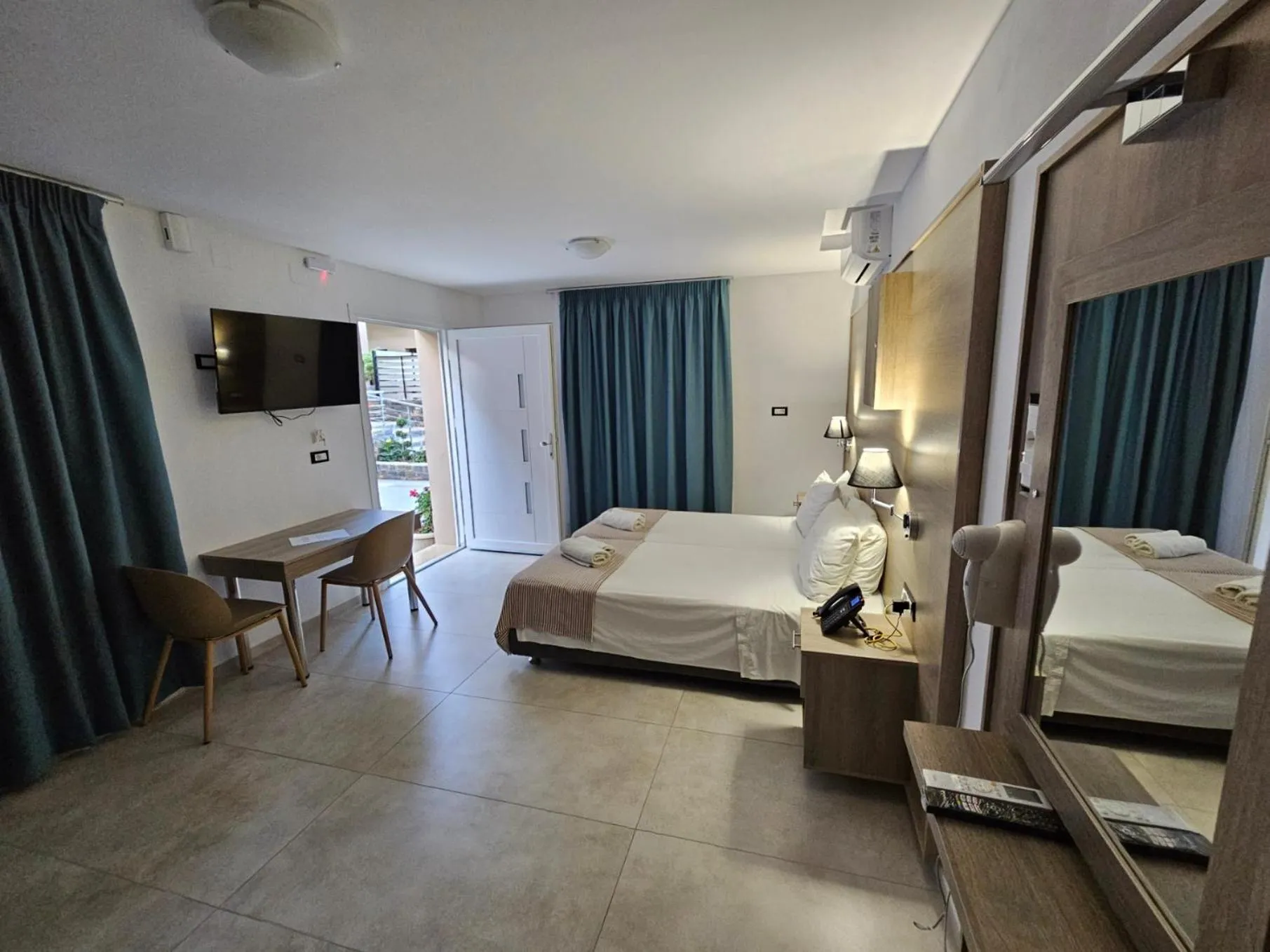 Bed in Elounda Sunrise Apartments