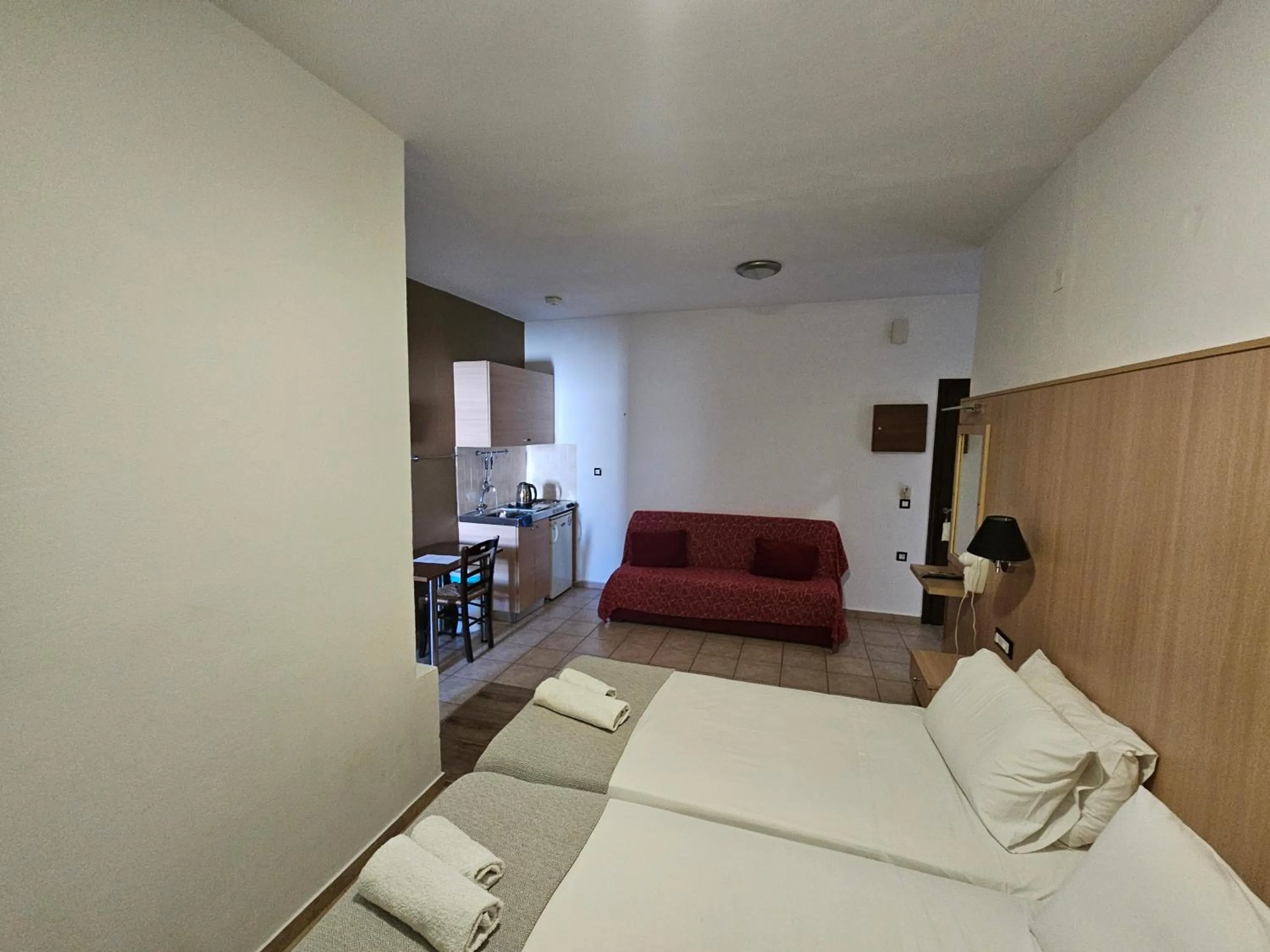 Bed in Elounda Sunrise Apartments