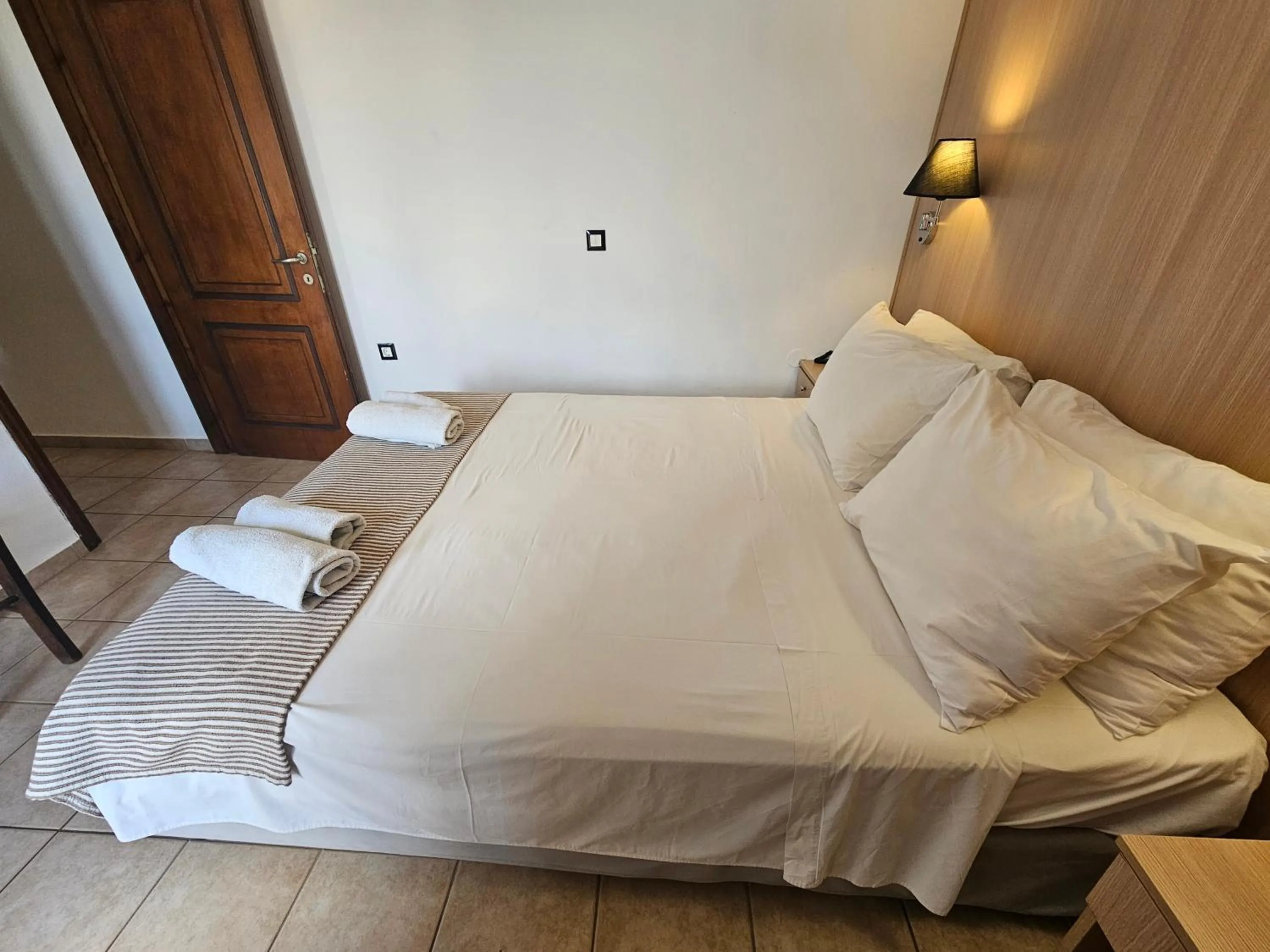 Bed in Elounda Sunrise Apartments