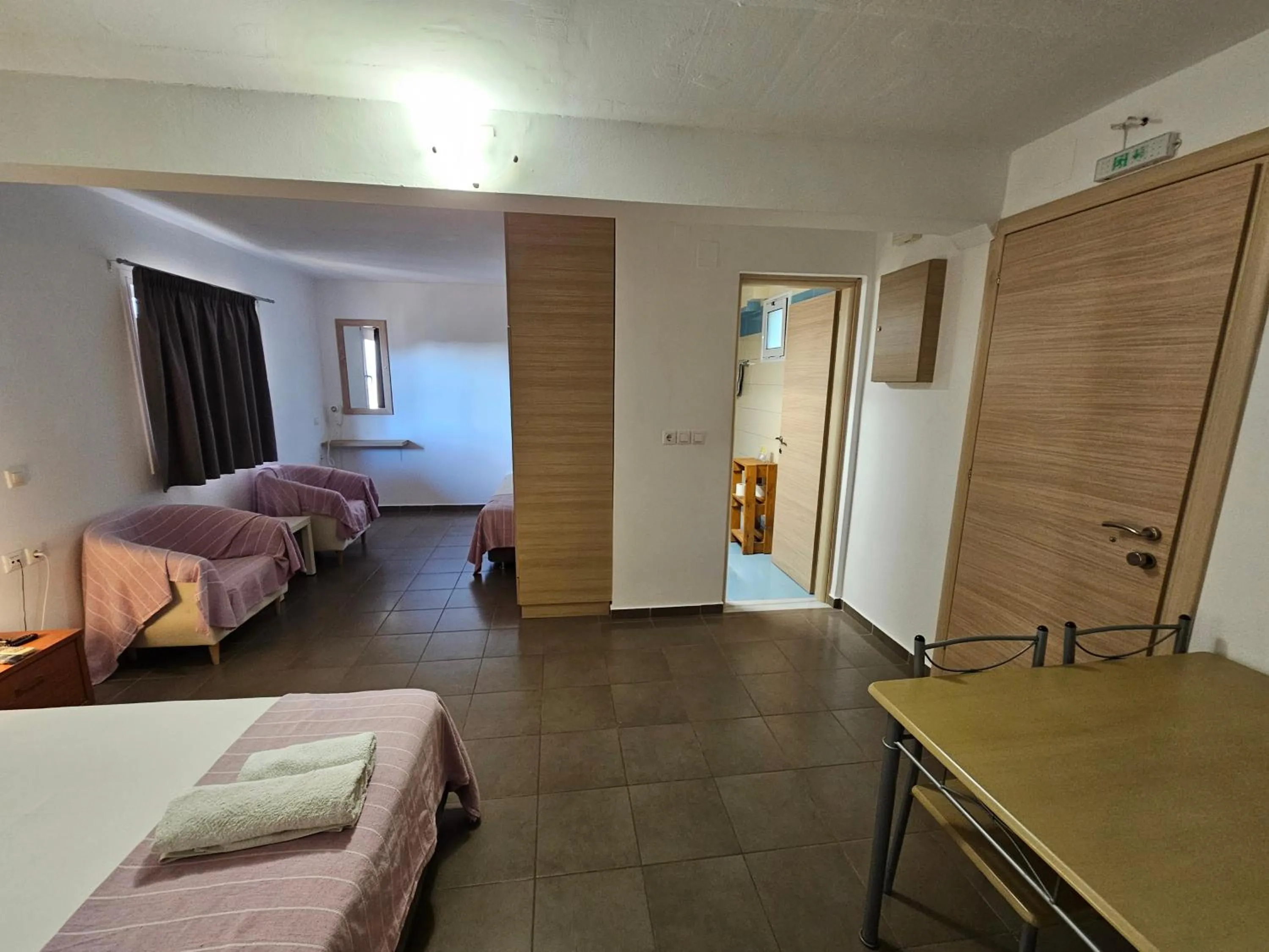 Bed in Elounda Sunrise Apartments