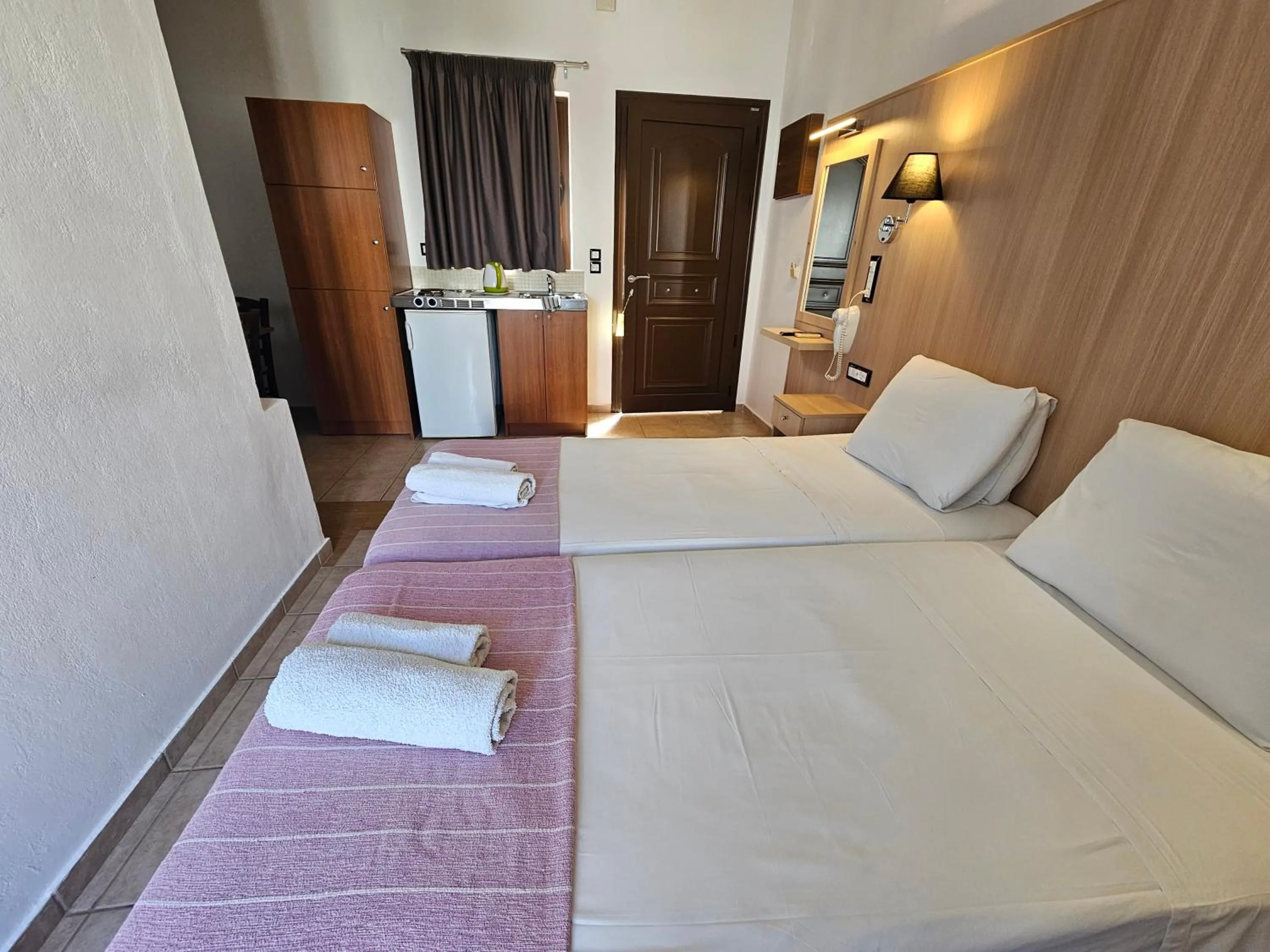 Bed in Elounda Sunrise Apartments