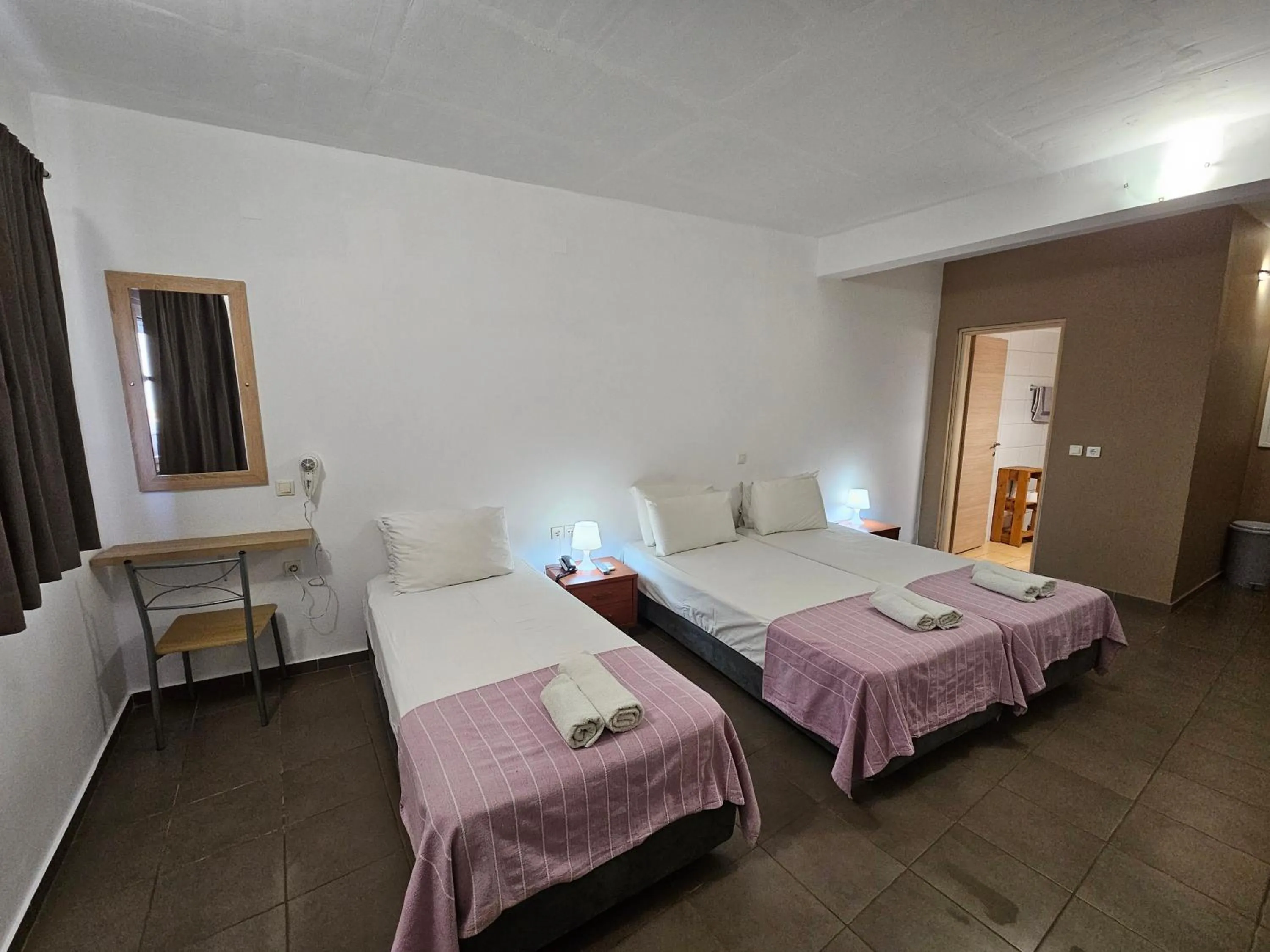 Bed in Elounda Sunrise Apartments