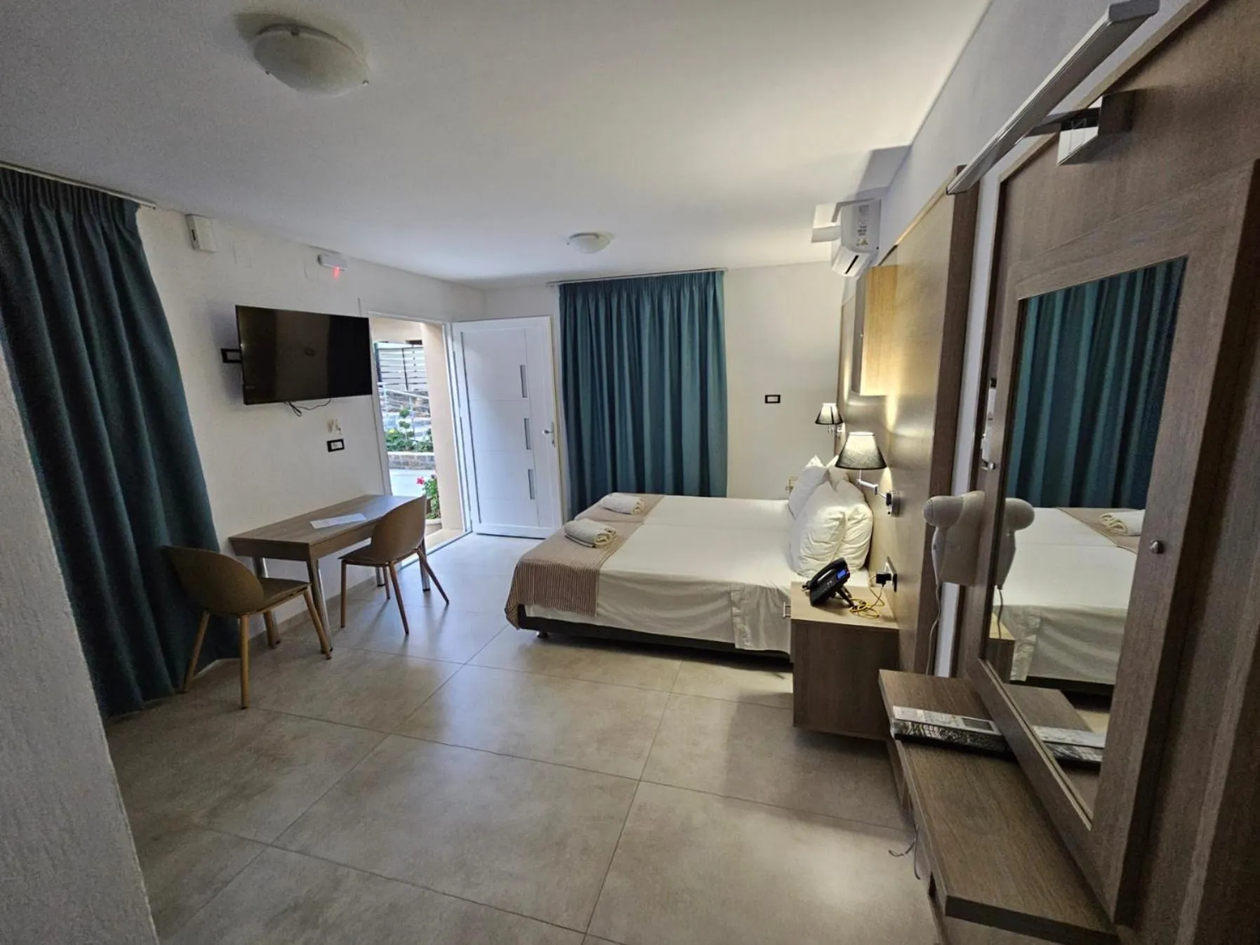 Bed in Elounda Sunrise Apartments