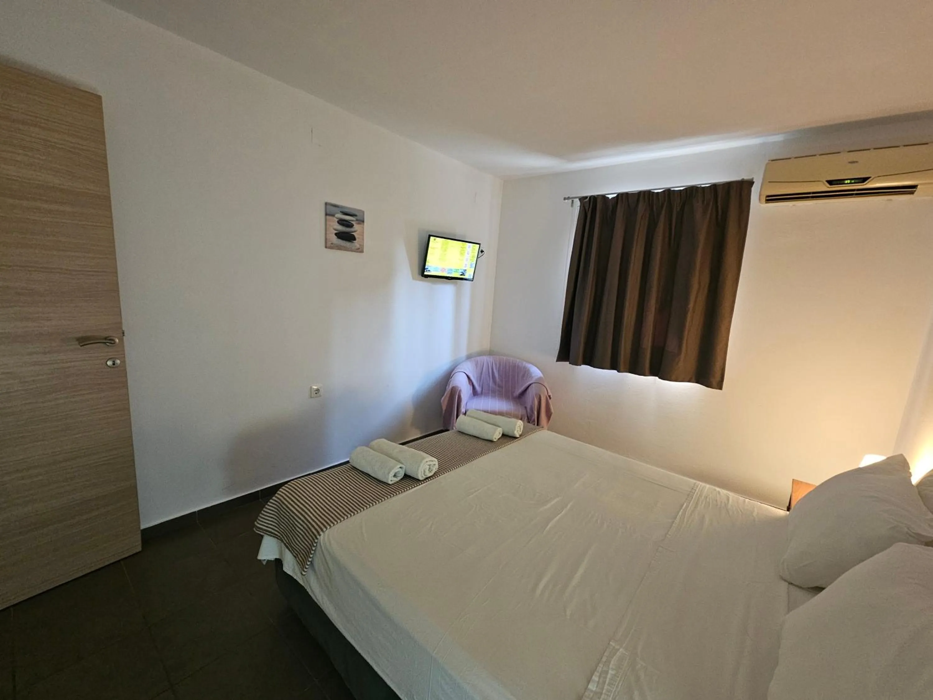 Bed in Elounda Sunrise Apartments