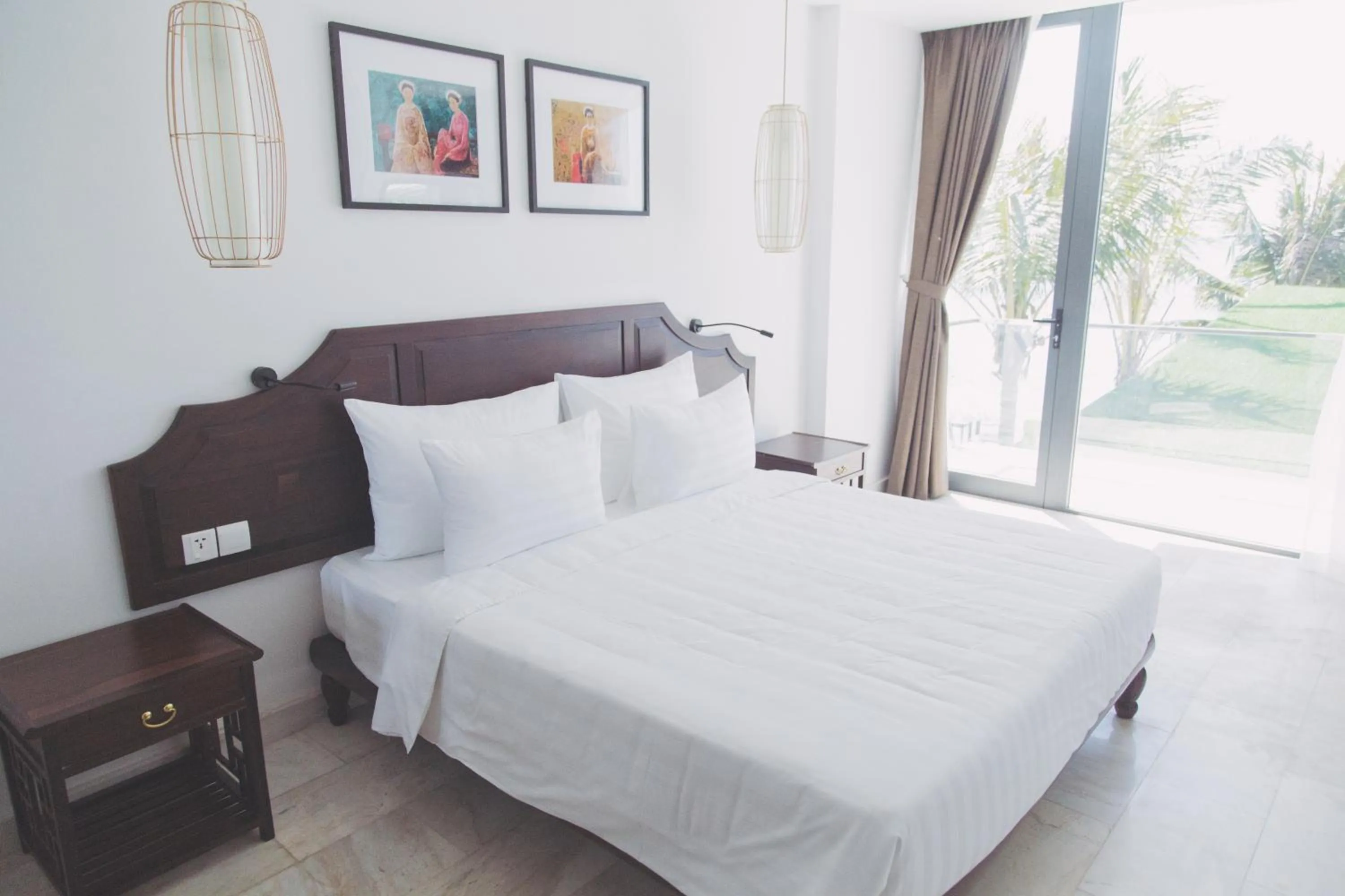 Bed in The Palmy Phu Quoc Resort & Spa