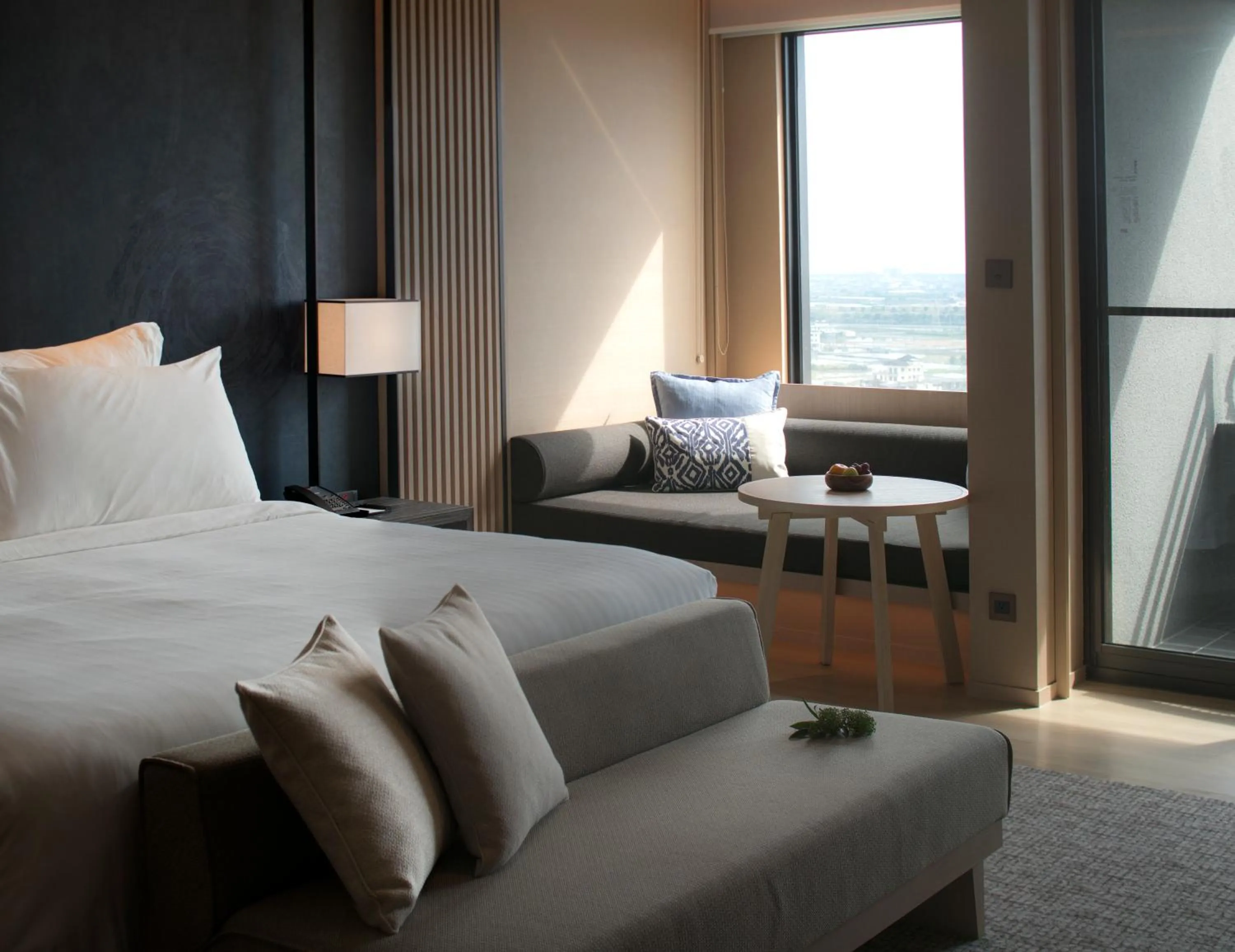 Seating area, Bed in MU Jiaoxi Hotel