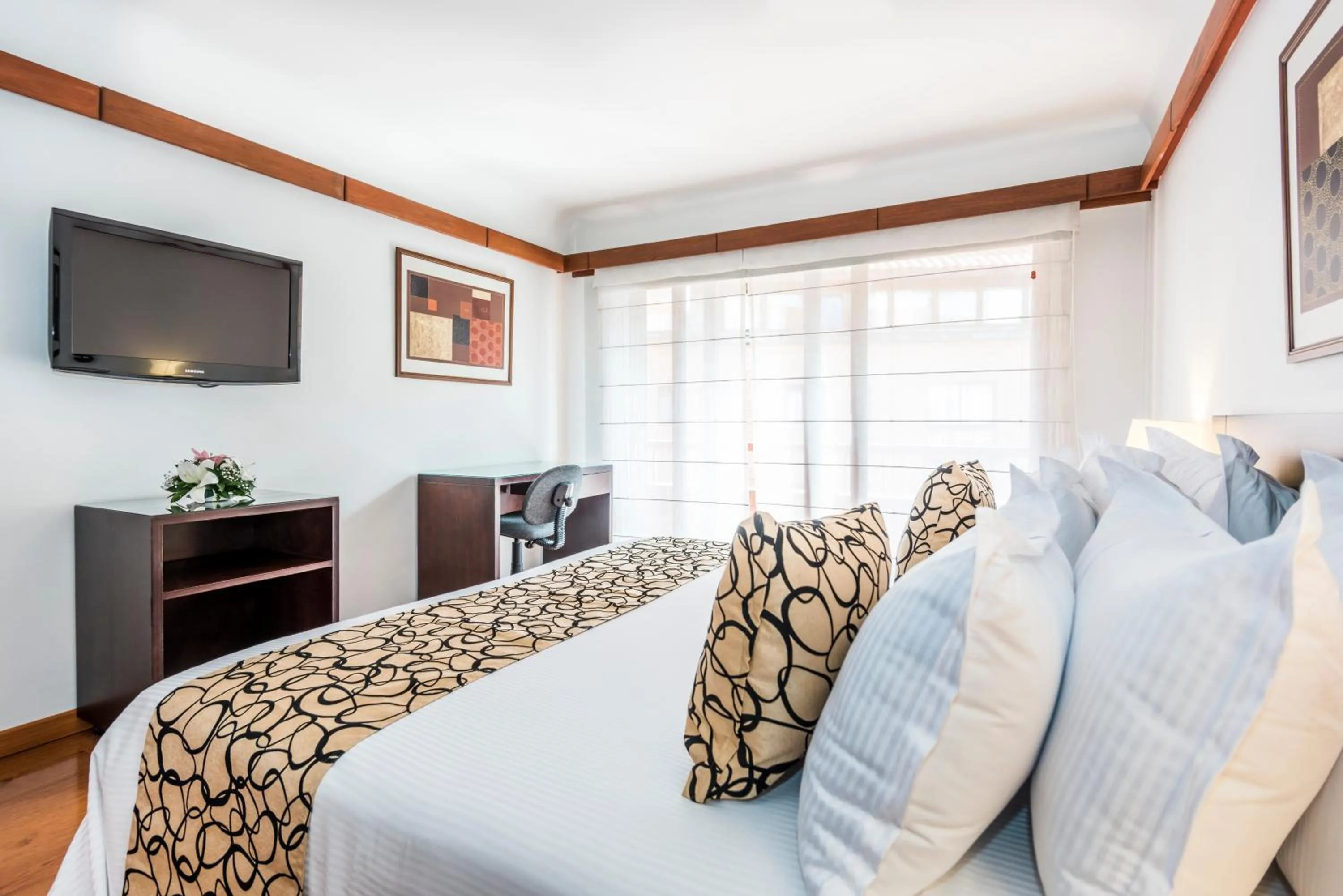 Bed in Travelers Condominio Plenitud