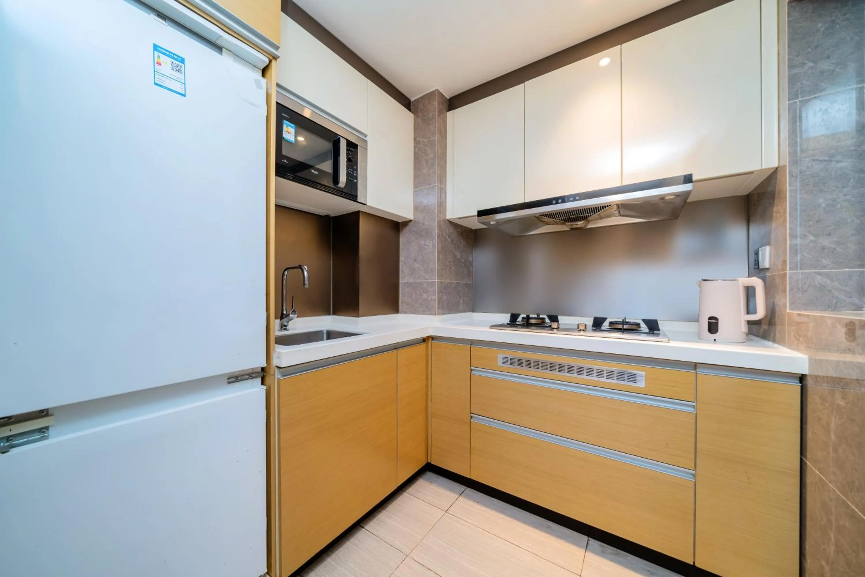 Kitchen or kitchenette in Heefun International Apartment