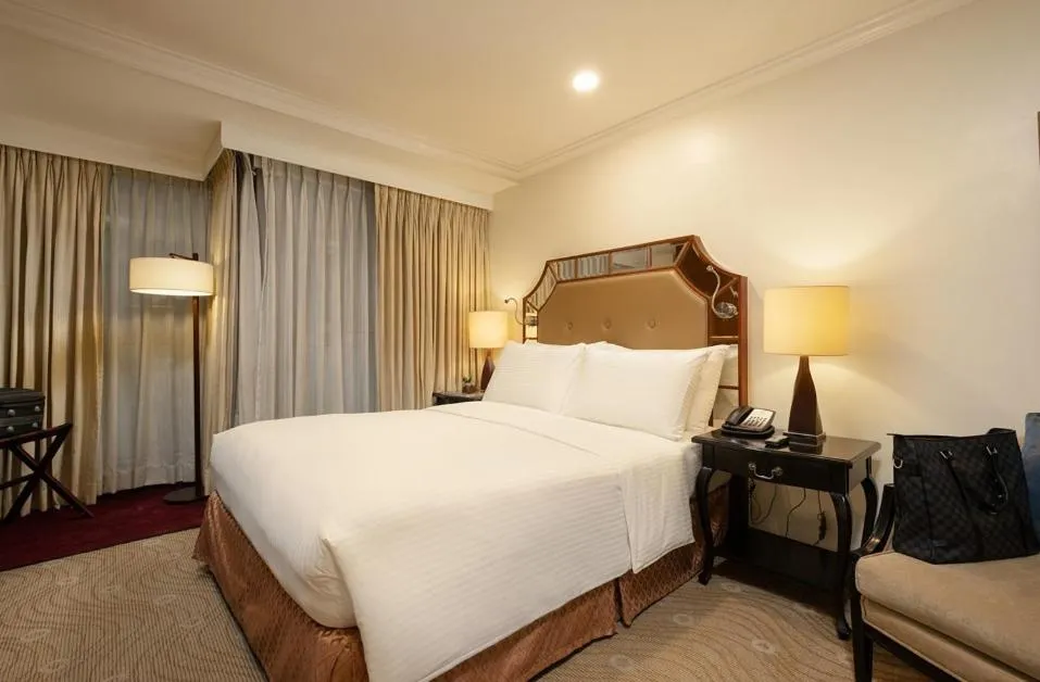 Bed in Discovery Suites Manila, Philippines