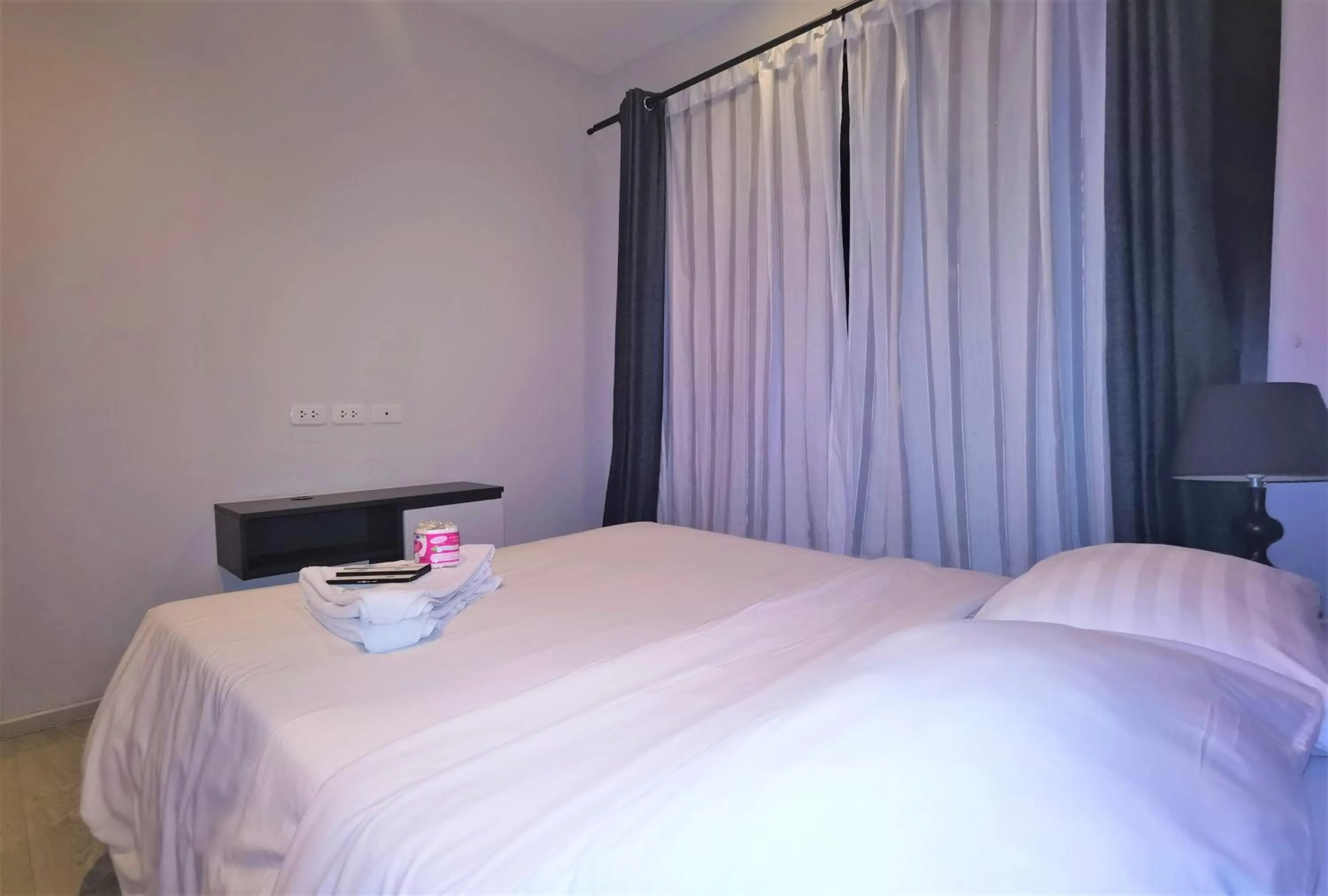 Bed in LLX Apartments at The Base condo