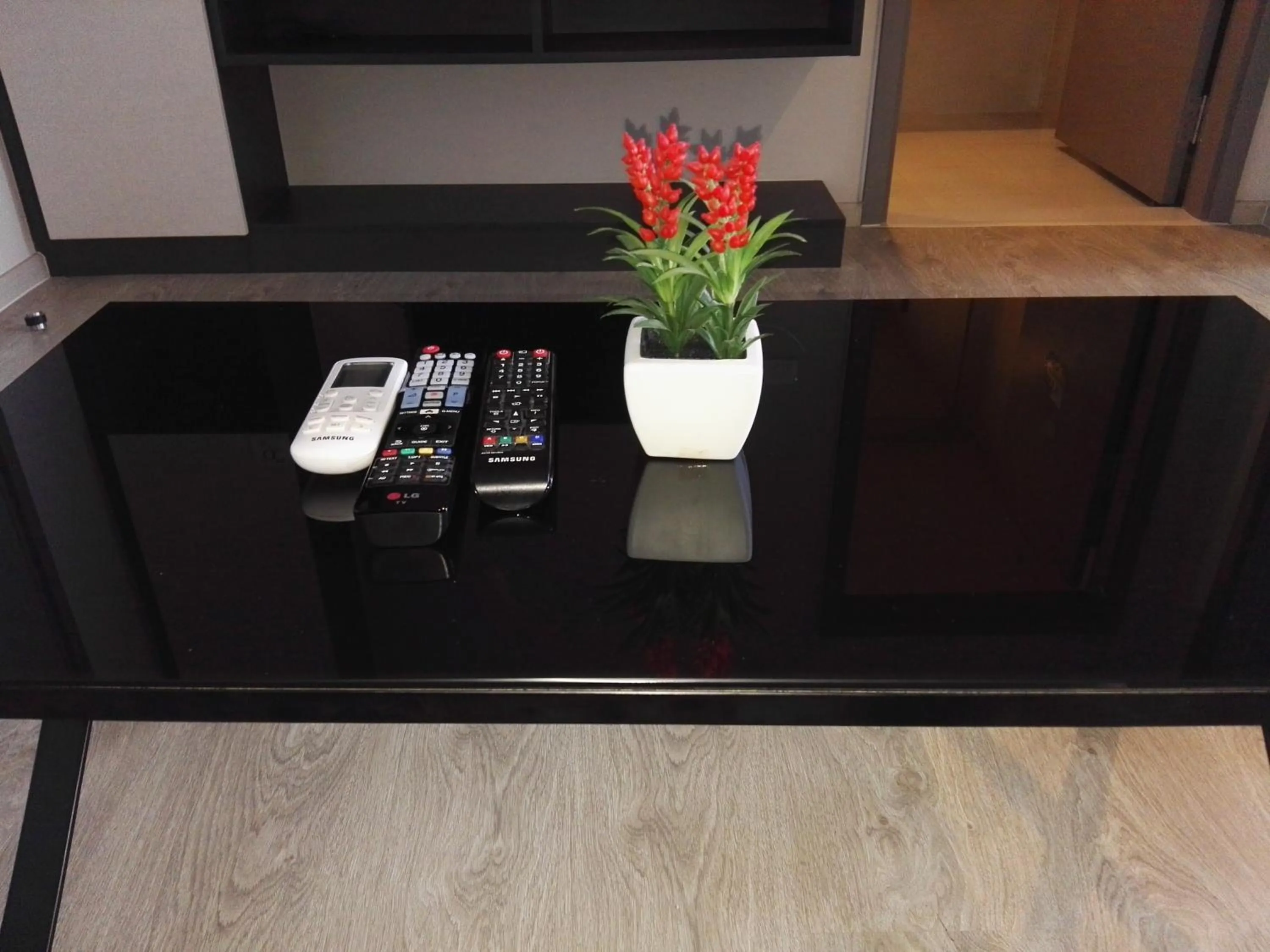 Living room in LLX Apartments at The Base condo