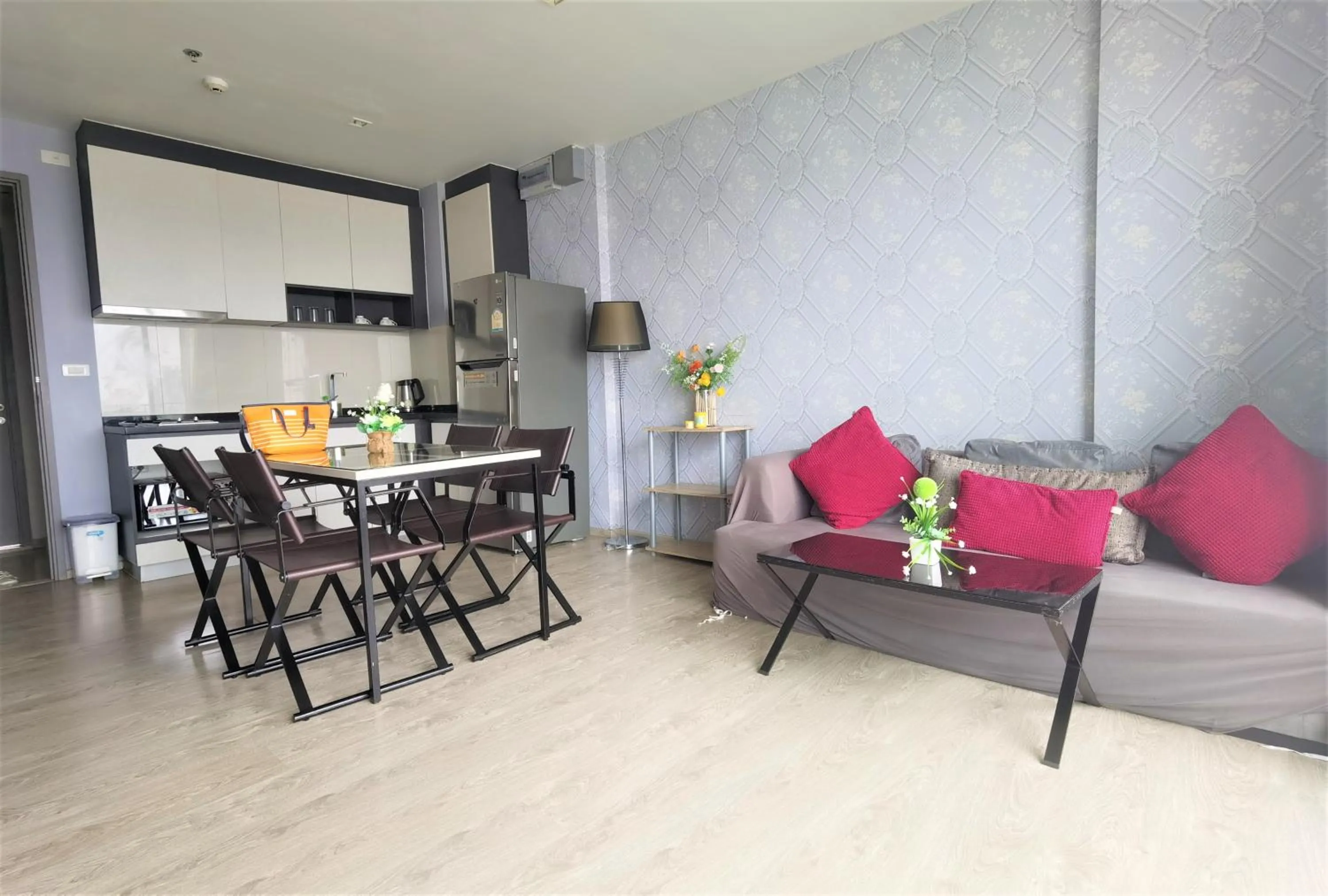 Living room in LLX Apartments at The Base condo