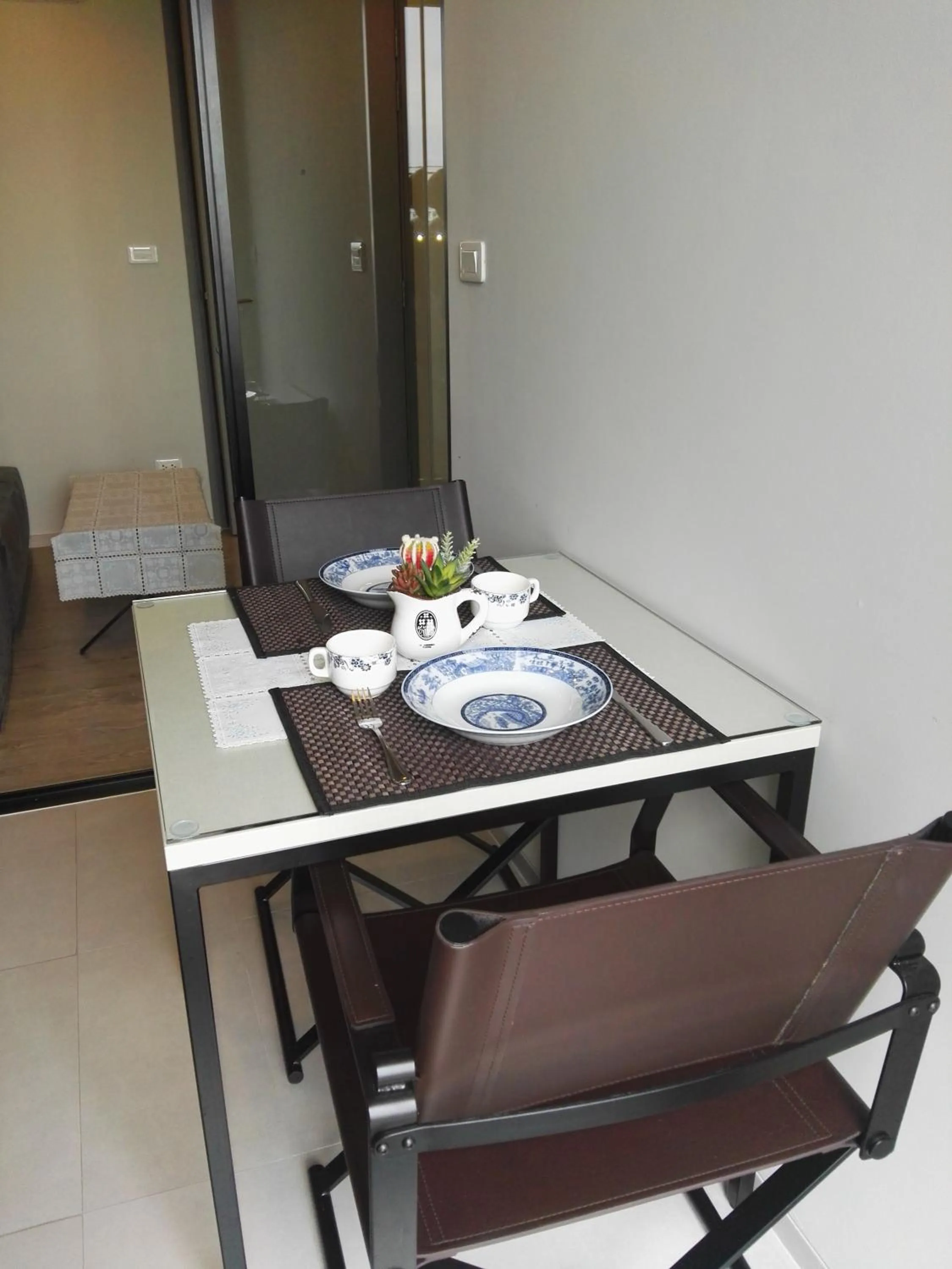 Dining area in LLX Apartments at The Base condo