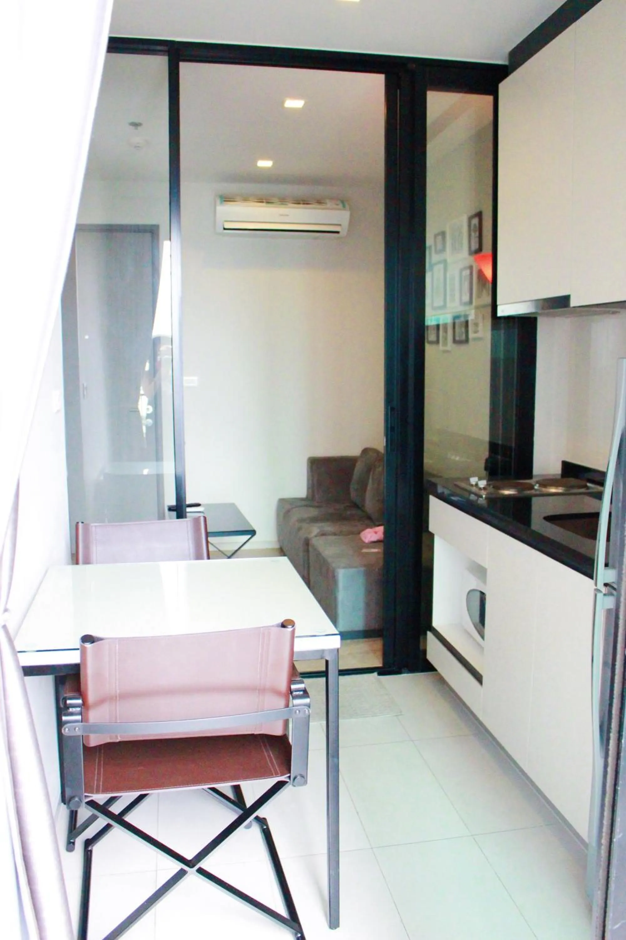 Dining area in LLX Apartments at The Base condo