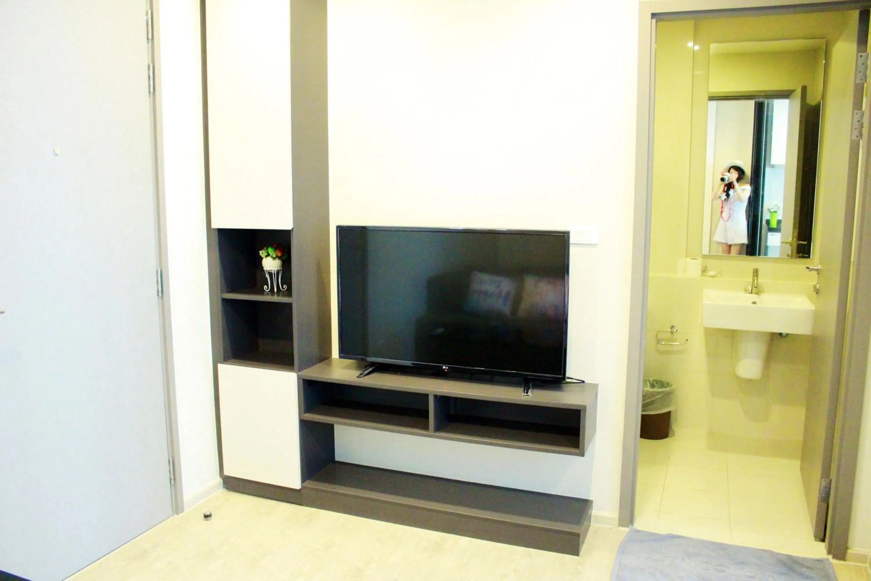Living room in LLX Apartments at The Base condo