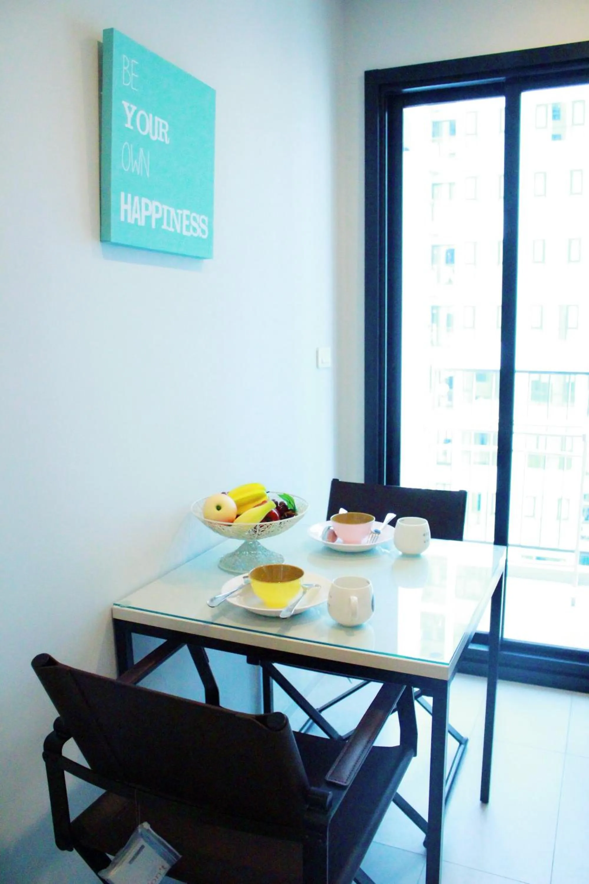 Dining area in LLX Apartments at The Base condo