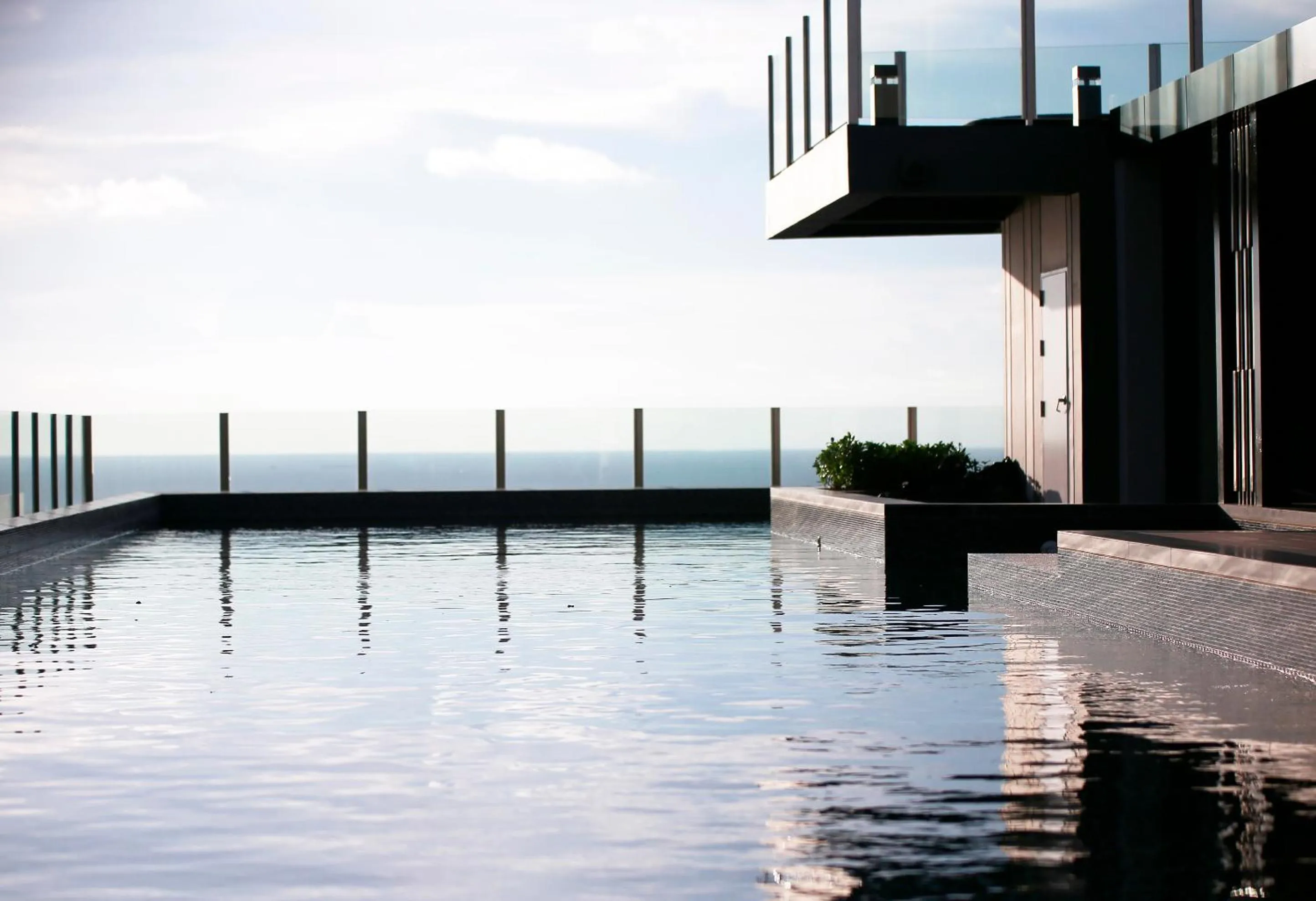 Pool view in LLX Apartments at The Base condo