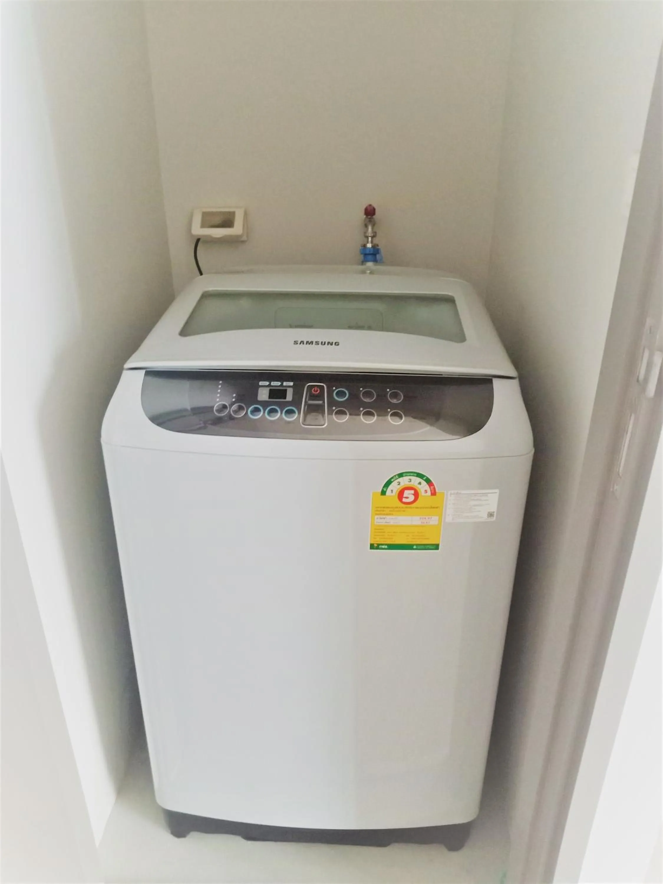 washing machine in LLX Apartments at The Base condo